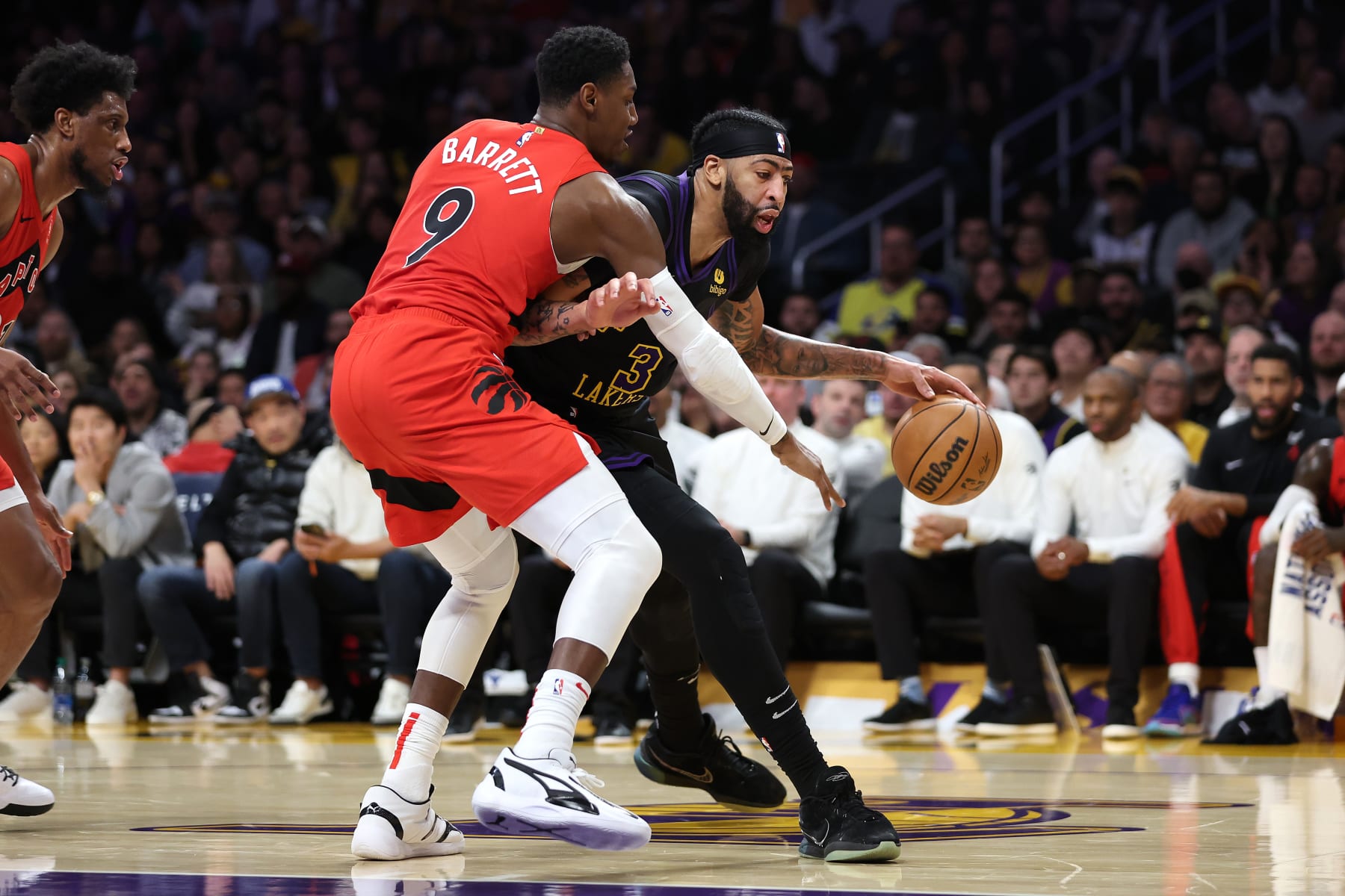 LOS ANGELES, CALIFORNIA - JANUARY 09: RJ Barrett #9 of the Toronto Raptors defends against the dribble of Anthony Davis #3 of the Los Angeles Lakers during the first half of a game at Crypto.com Arena on January 09, 2024 in Los Angeles, California.  NOTE TO USER: User expressly acknowledges and agrees that, by downloading and or using this photograph, User is consenting to the terms and conditions of the Getty Images License Agreement. (Photo by Sean M. Haffey/Getty Images)