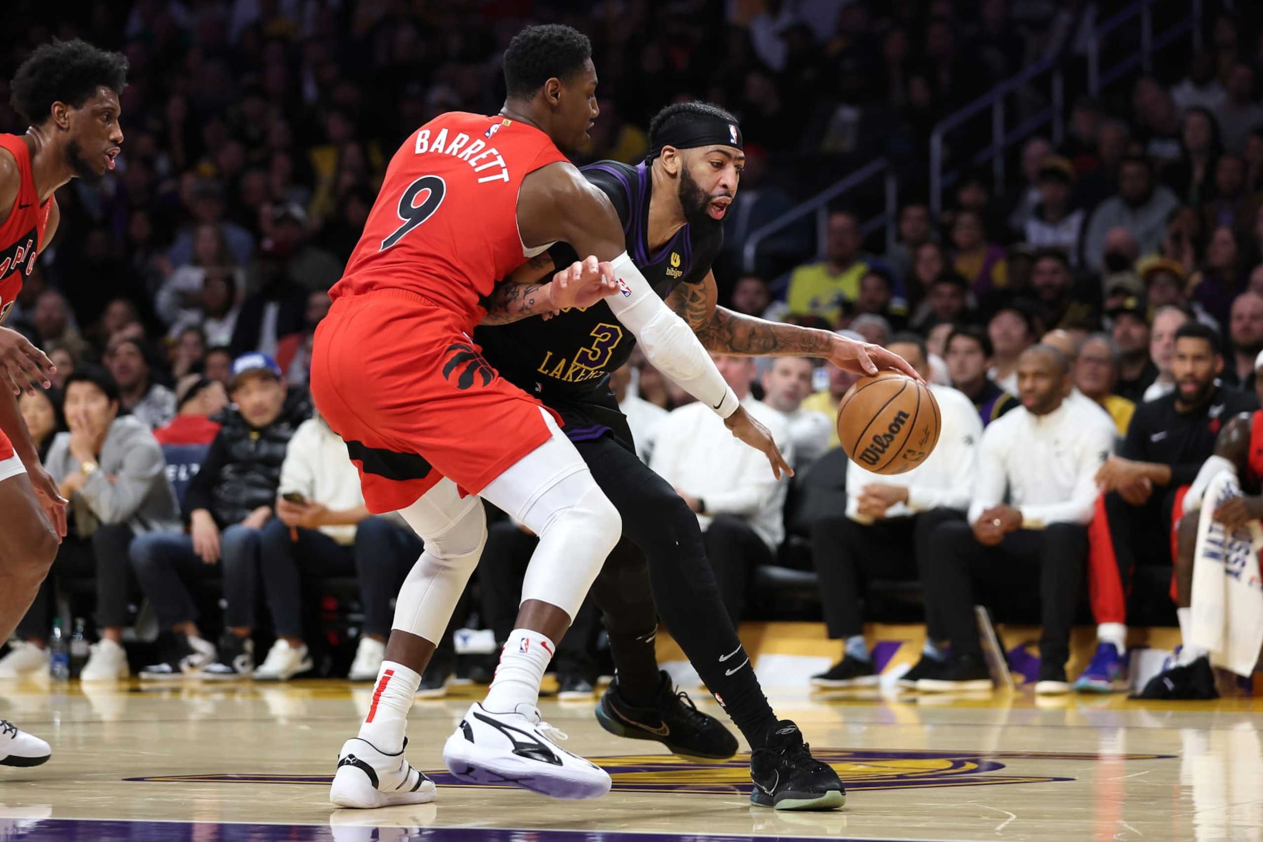 LOS ANGELES, CALIFORNIA - JANUARY 09: RJ Barrett #9 of the Toronto Raptors defends against the dribble of Anthony Davis #3 of the Los Angeles Lakers during the first half of a game at Crypto.com Arena on January 09, 2024 in Los Angeles, California.  NOTE TO USER: User expressly acknowledges and agrees that, by downloading and or using this photograph, User is consenting to the terms and conditions of the Getty Images License Agreement. (Photo by Sean M. Haffey/Getty Images)