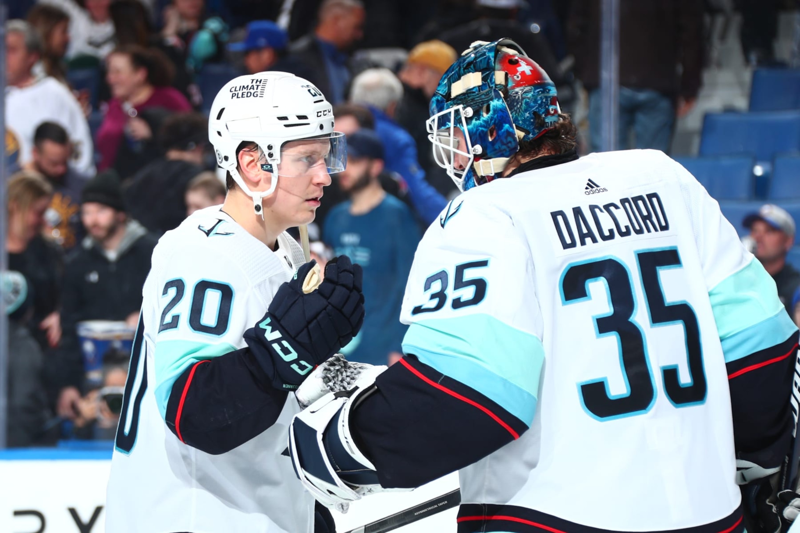 BUFFALO, NEW YORK - JANUARY 9: Eeli Tolvanen #20 celebrates with Joey Daccord #35 of the Seattle Kraken after an NHL game against the Buffalo Sabres on January 9, 2024 at KeyBank Center in Buffalo, New York. Seattle won, 5-2. (Photo by Bill Wippert/NHLI via Getty Images) BUFFALO, NEW YORK - JANUARY 9: Eeli Tolvanen #20 celebrates with Joey Daccord #35 of the Seattle Kraken after an NHL game against the Buffalo Sabres on January 9, 2024 at KeyBank Center in Buffalo, New York. Seattle won, 5-2. (Photo by Bill Wippert/NHLI via Getty Images)