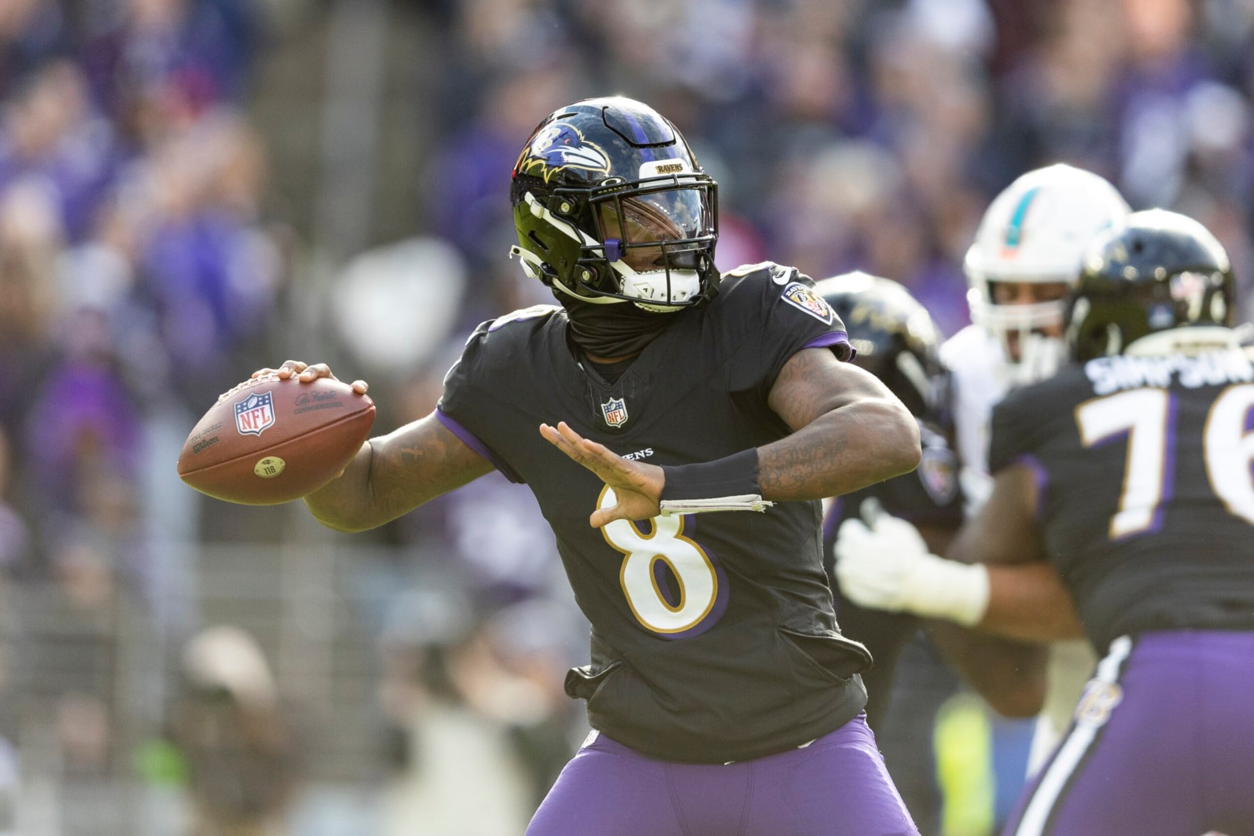 BALTIMORE, MARYLAND - DECEMBER 31: Lamar Jackson #8 of the Baltimore Ravens drops back and looks to pass during an NFL football game between the Baltimore Ravens and the Miami Dolphins at M&T Bank Stadium on December 31, 2023 in Baltimore, Maryland. (Photo by Michael Owens/Getty Images)
