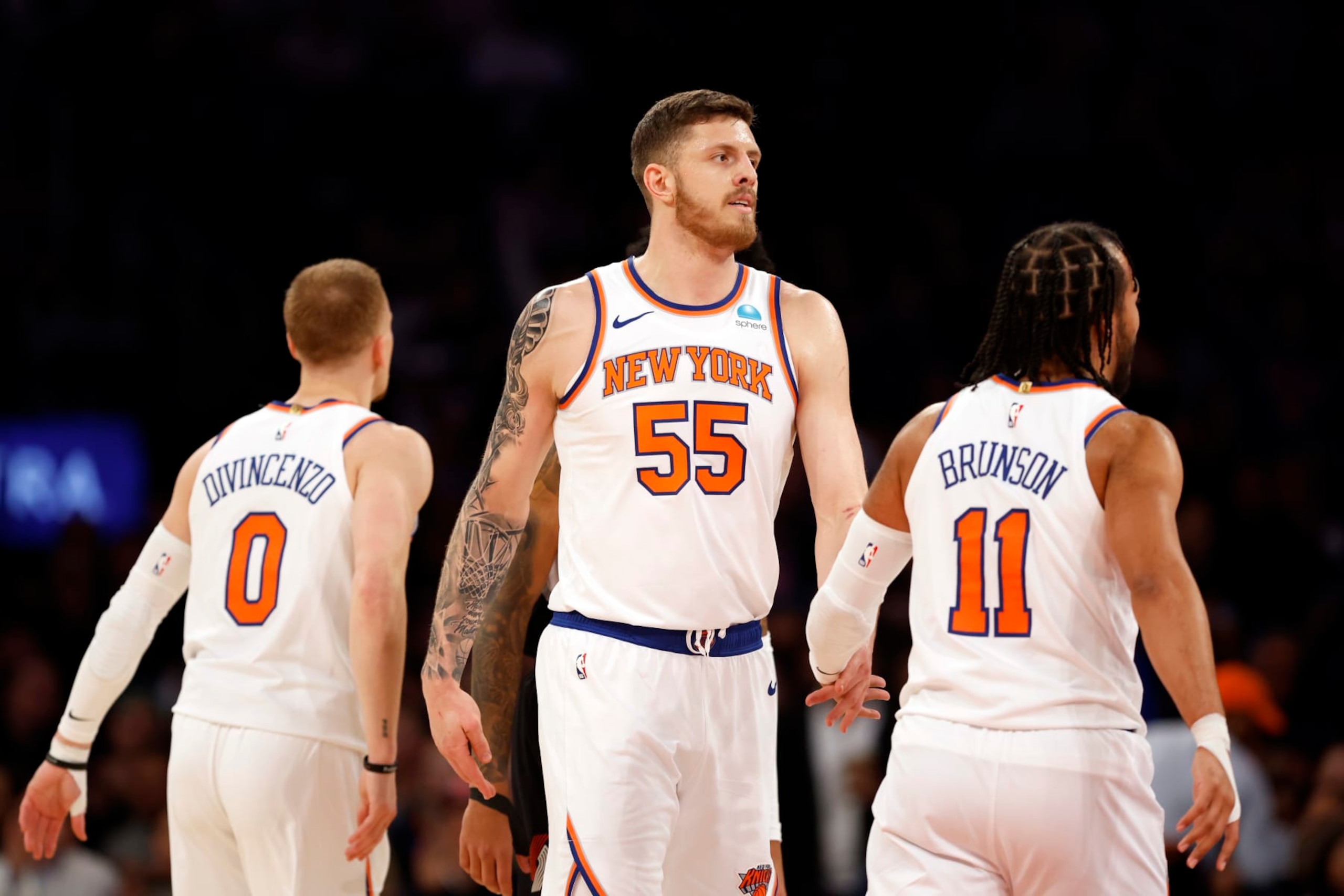 NEW YORK, NEW YORK - JANUARY 09: Isaiah Hartenstein #55 reacts with Donte DiVincenzo #0 and Jalen Brunson #11 of the New York Knicks during the first half against the Portland Trail Blazers at Madison Square Garden on January 09, 2024 in New York City. NOTE TO USER: User expressly acknowledges and agrees that, by downloading and/or using this Photograph, user is consenting to the terms and conditions of the Getty Images License Agreement. (Photo by Sarah Stier/Getty Images) NEW YORK, NEW YORK - JANUARY 09: Isaiah Hartenstein #55 reacts with Donte DiVincenzo #0 and Jalen Brunson #11 of the New York Knicks during the first half against the Portland Trail Blazers at Madison Square Garden on January 09, 2024 in New York City. NOTE TO USER: User expressly acknowledges and agrees that, by downloading and/or using this Photograph, user is consenting to the terms and conditions of the Getty Images License Agreement. (Photo by Sarah Stier/Getty Images)
