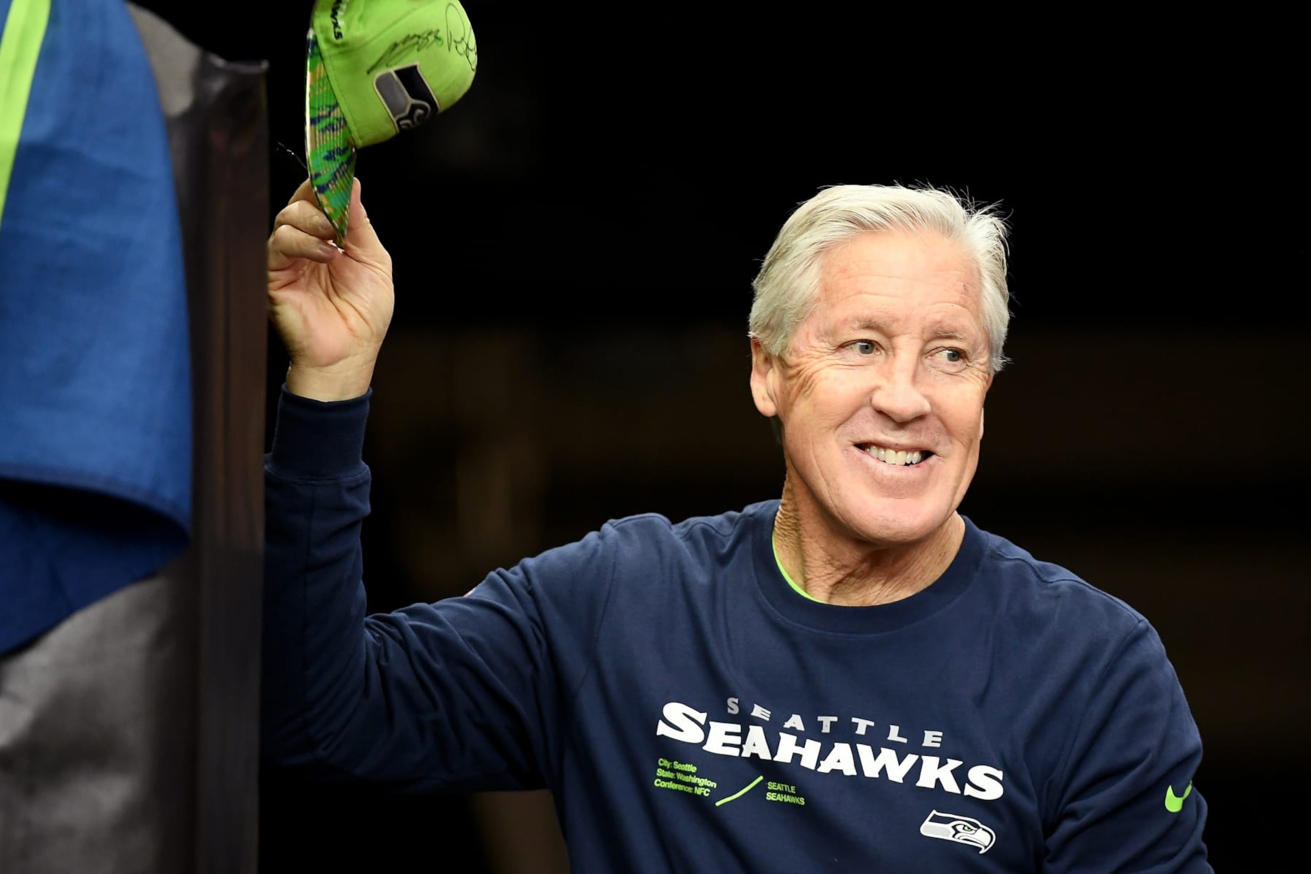 GLENDALE, ARIZONA - JANUARY 07: Seattle Seahawks head coach Pete Carroll signs autographs for fans before the game against the Arizona Cardinals at State Farm Stadium on January 07, 2024 in Glendale, Arizona. (Photo by Jennifer Stewart/Getty Images) GLENDALE, ARIZONA - JANUARY 07: Seattle Seahawks head coach Pete Carroll signs autographs for fans before the game against the Arizona Cardinals at State Farm Stadium on January 07, 2024 in Glendale, Arizona. (Photo by Jennifer Stewart/Getty Images)
