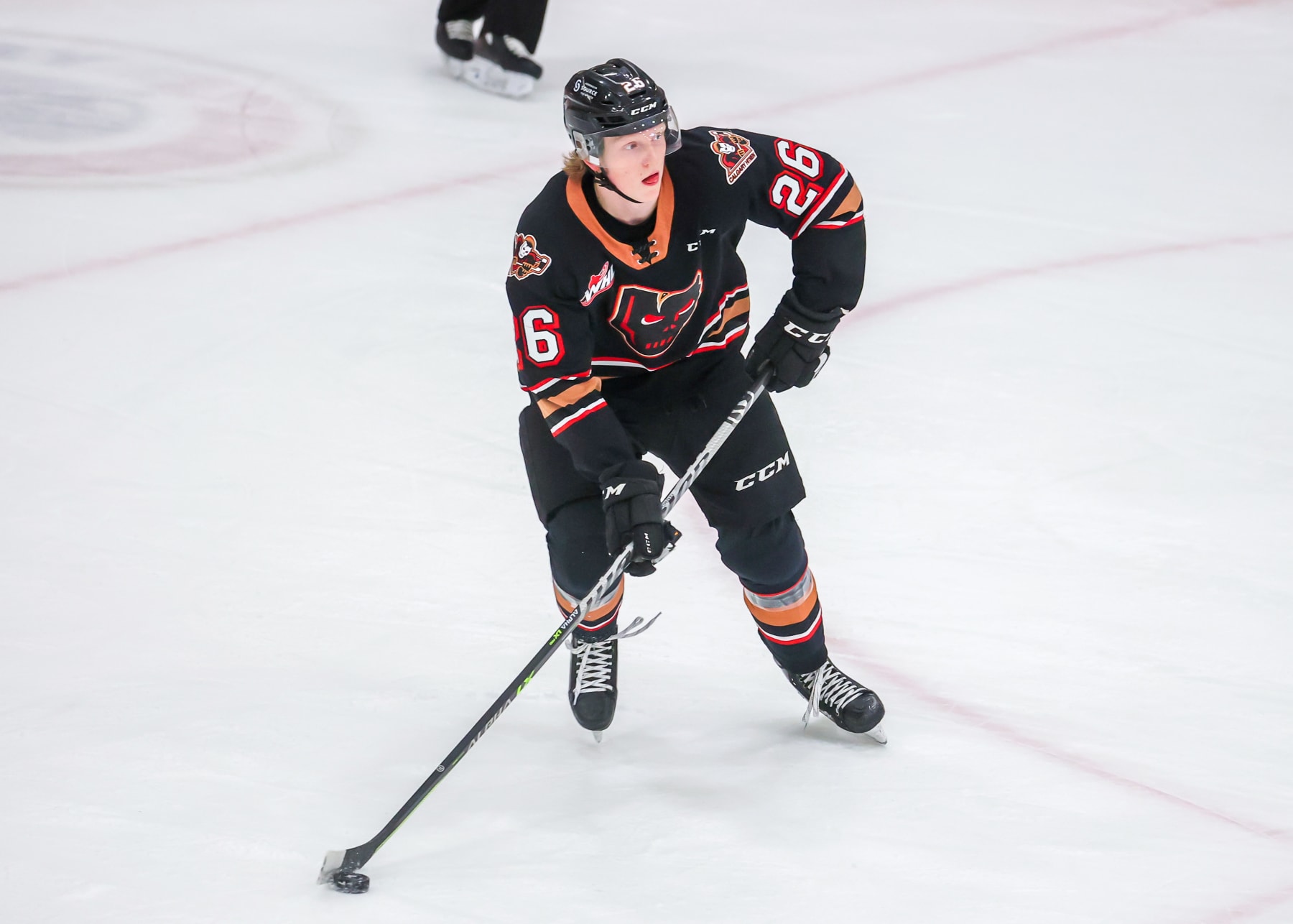 WINNIPEG, CANADA - FEBRUARY 08: Carter Yakemchuk #26 of the Calgary Hitmen plays the puck during first period action against the Winnipeg ICE at Wayne Fleming Arena on February 08, 2023 in Winnipeg, Manitoba, Canada. (Photo by Jonathan Kozub/Getty Images)