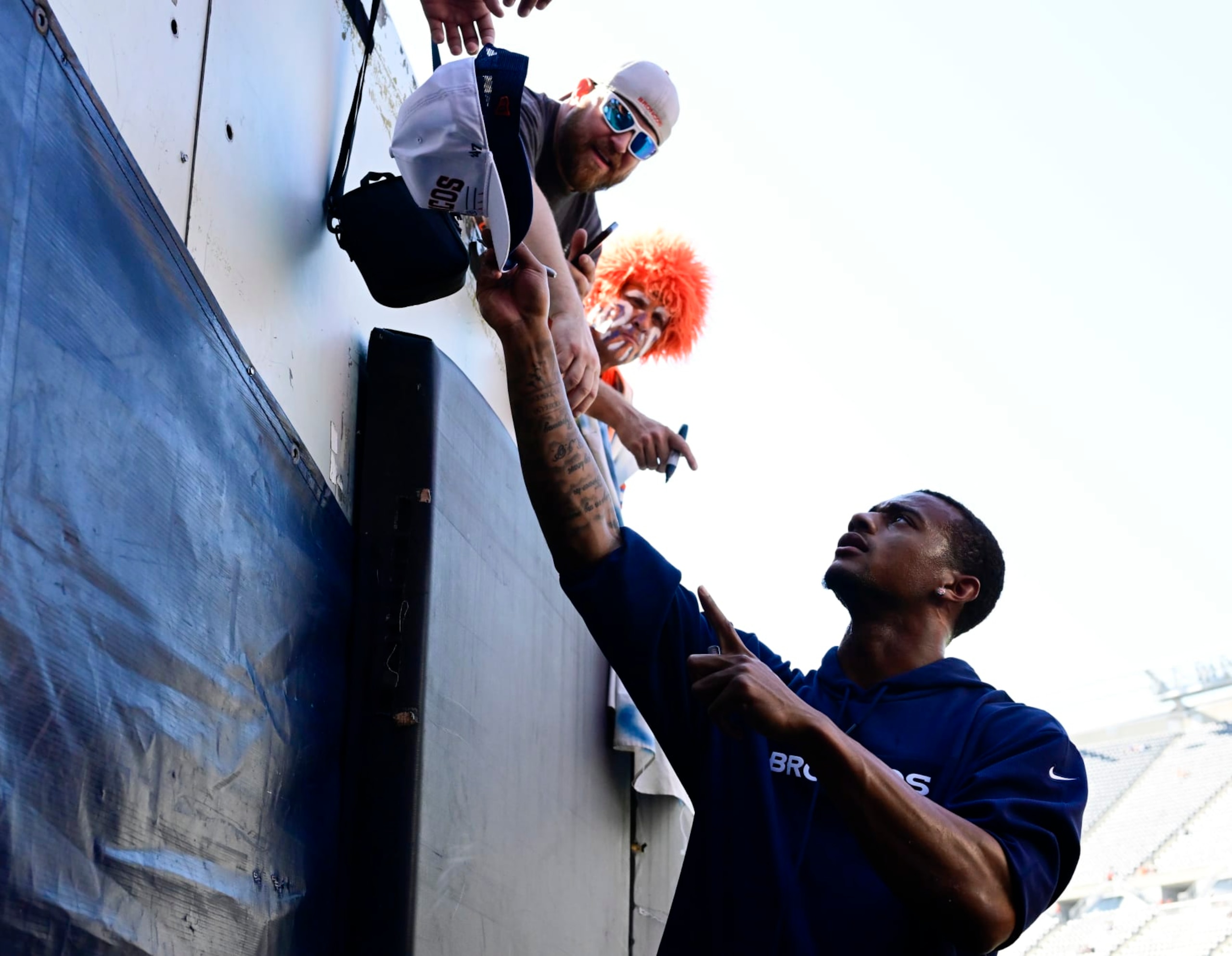 CHICAGO, IL - OCTOBER 01: Denver Broncos cornerback Pat Surtain II (2) hands a few autographed hats back to fans before the game against the Chicago Bears at Soldier Field in October 01, 2023. (Photo by Andy Cross/MediaNews Group/The Denver Post via Getty Images) CHICAGO, IL - OCTOBER 01: Denver Broncos cornerback Pat Surtain II (2) hands a few autographed hats back to fans before the game against the Chicago Bears at Soldier Field in October 01, 2023. (Photo by Andy Cross/MediaNews Group/The Denver Post via Getty Images)