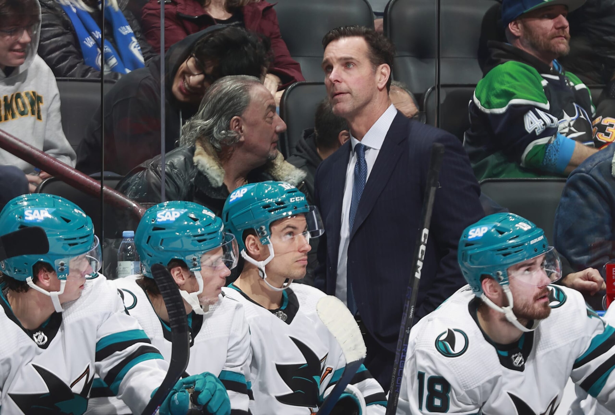 VANCOUVER, CANADA - DECEMBER 23: Head coach David Quinn of the San Jose Sharks looks on from the benchd uring their NHL game against the Vancouver Canucks at Rogers Arena on December 23, 2023 in Vancouver, British Columbia, Canada. (Photo by Jeff Vinnick/NHLI via Getty Images) VANCOUVER, CANADA - DECEMBER 23: Head coach David Quinn of the San Jose Sharks looks on from the benchd uring their NHL game against the Vancouver Canucks at Rogers Arena on December 23, 2023 in Vancouver, British Columbia, Canada. (Photo by Jeff Vinnick/NHLI via Getty Images)
