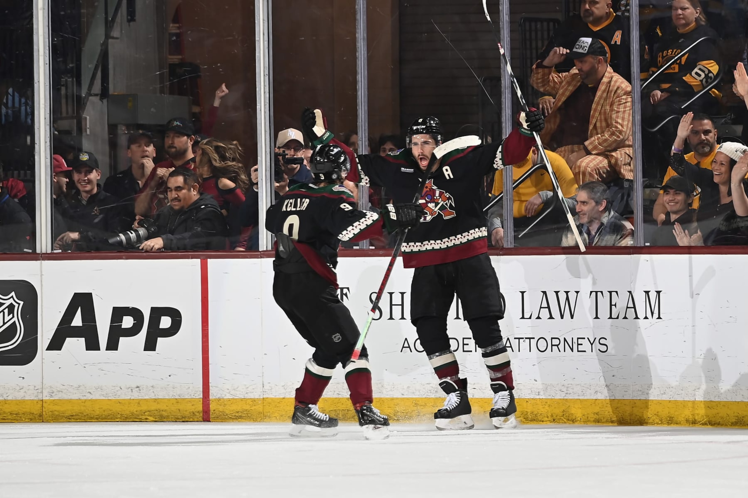TEMPE, ARIZONA - JANUARY 09: Nick Schmaltz #8 of the Arizona Coyotes celebrates with teammate Clayton Keller #9 afte scoring a goal in overtime to defeat the Boston Bruins 4-3 at Mullett Arena on January 09, 2024 in Tempe, Arizona. (Photo by Norm Hall/NHLI via Getty Images) TEMPE, ARIZONA - JANUARY 09: Nick Schmaltz #8 of the Arizona Coyotes celebrates with teammate Clayton Keller #9 afte scoring a goal in overtime to defeat the Boston Bruins 4-3 at Mullett Arena on January 09, 2024 in Tempe, Arizona. (Photo by Norm Hall/NHLI via Getty Images)