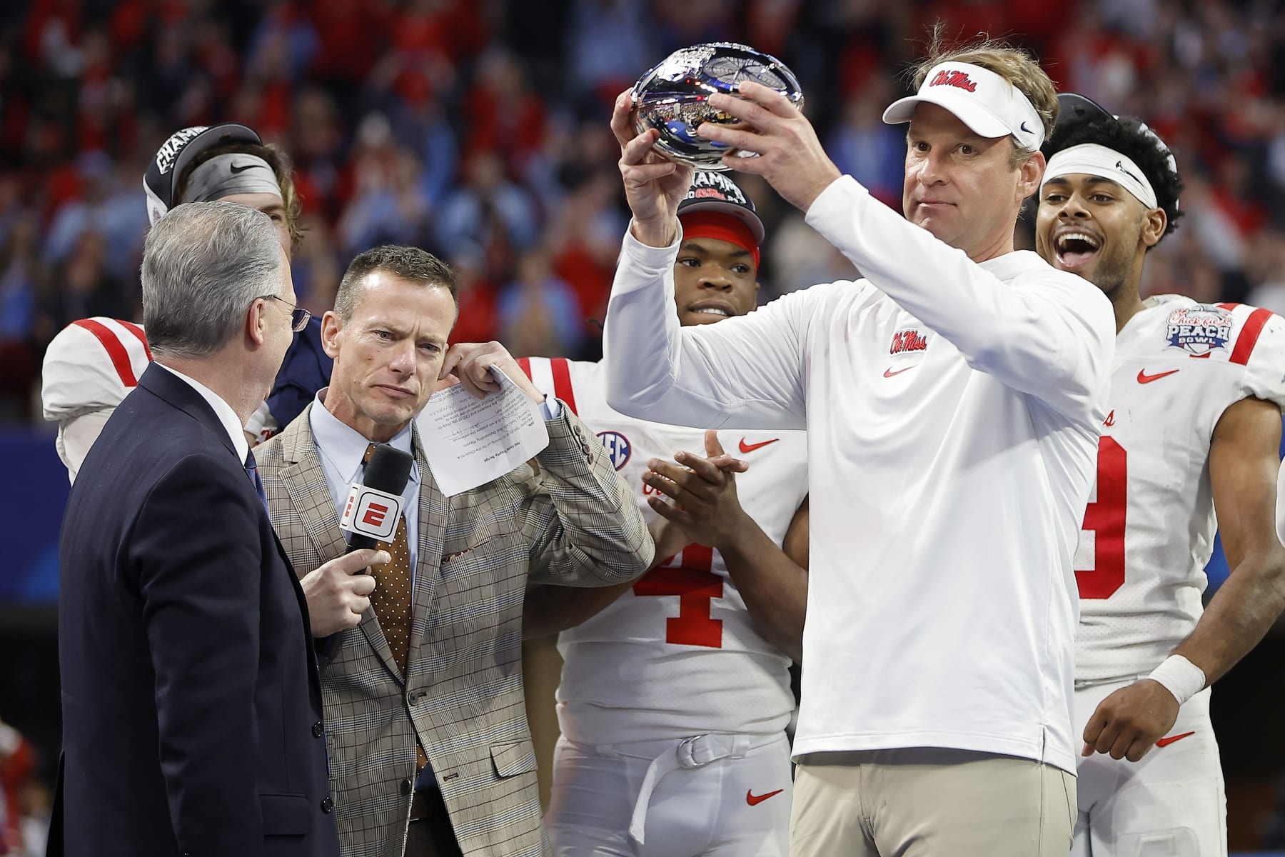 ATLANTA, GEORGIA - DECEMBER 30: Head coach Lane Kiffin of the Mississippi Rebels celebrates with the team after beating Penn State Nittany Lions during the Chick-fil-A Peach Bowl at Mercedes-Benz Stadium on December 30, 2023 in Atlanta, Georgia. (Photo by Alex Slitz/Getty Images)