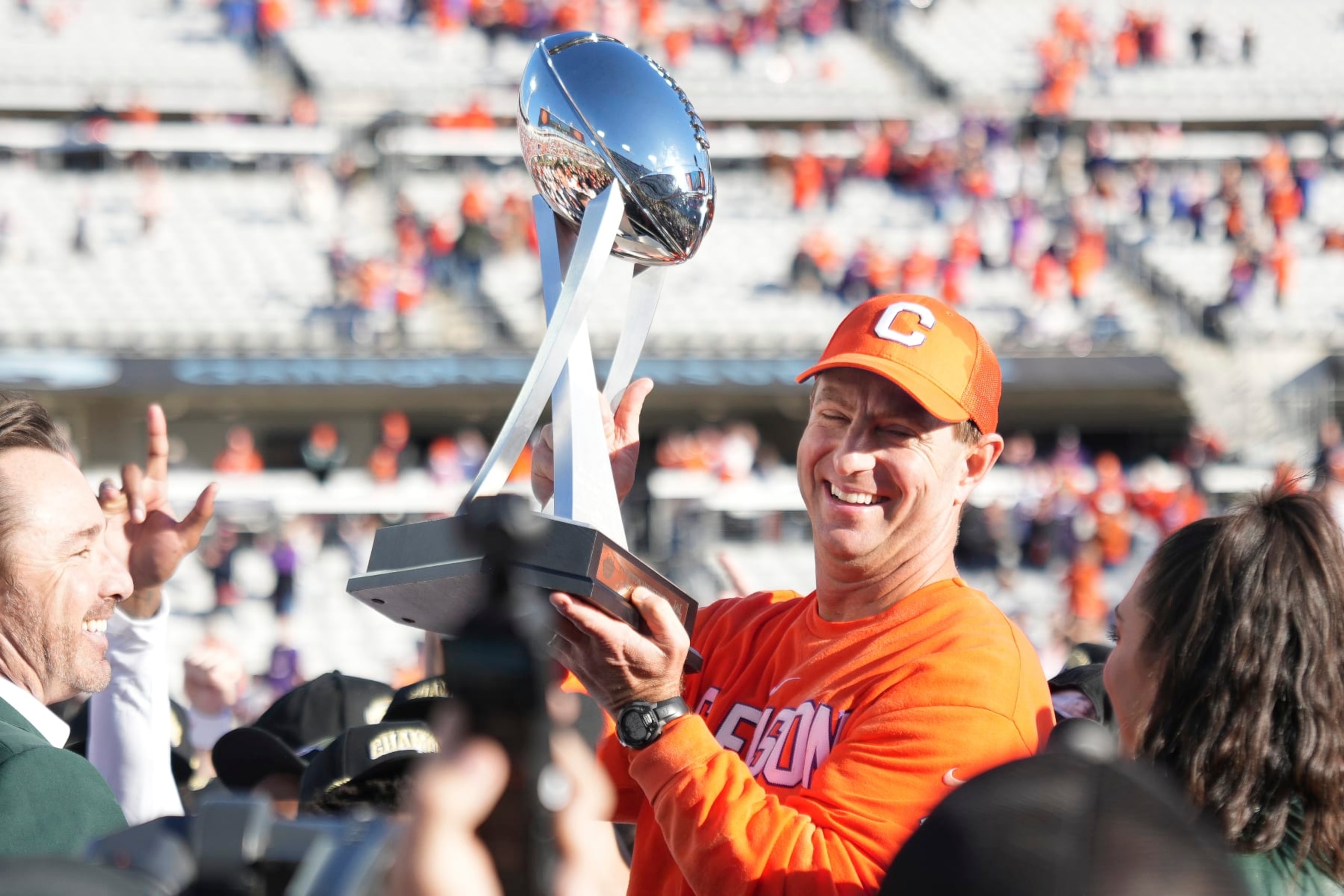 JACKSONVILLE, FL - DECEMBER 29: Clemson Tigers head coach Dabo Swinney hold up the game trophy following rhe TaxSlayer Gator Bowl between the Clemson Tigers and the Kentucky Wildcats on Friday, December 29, 2023 at EverBank Stadium, Jacksonville, Fla. (Photo by Peter Joneleit/Icon Sportswire via Getty Images)