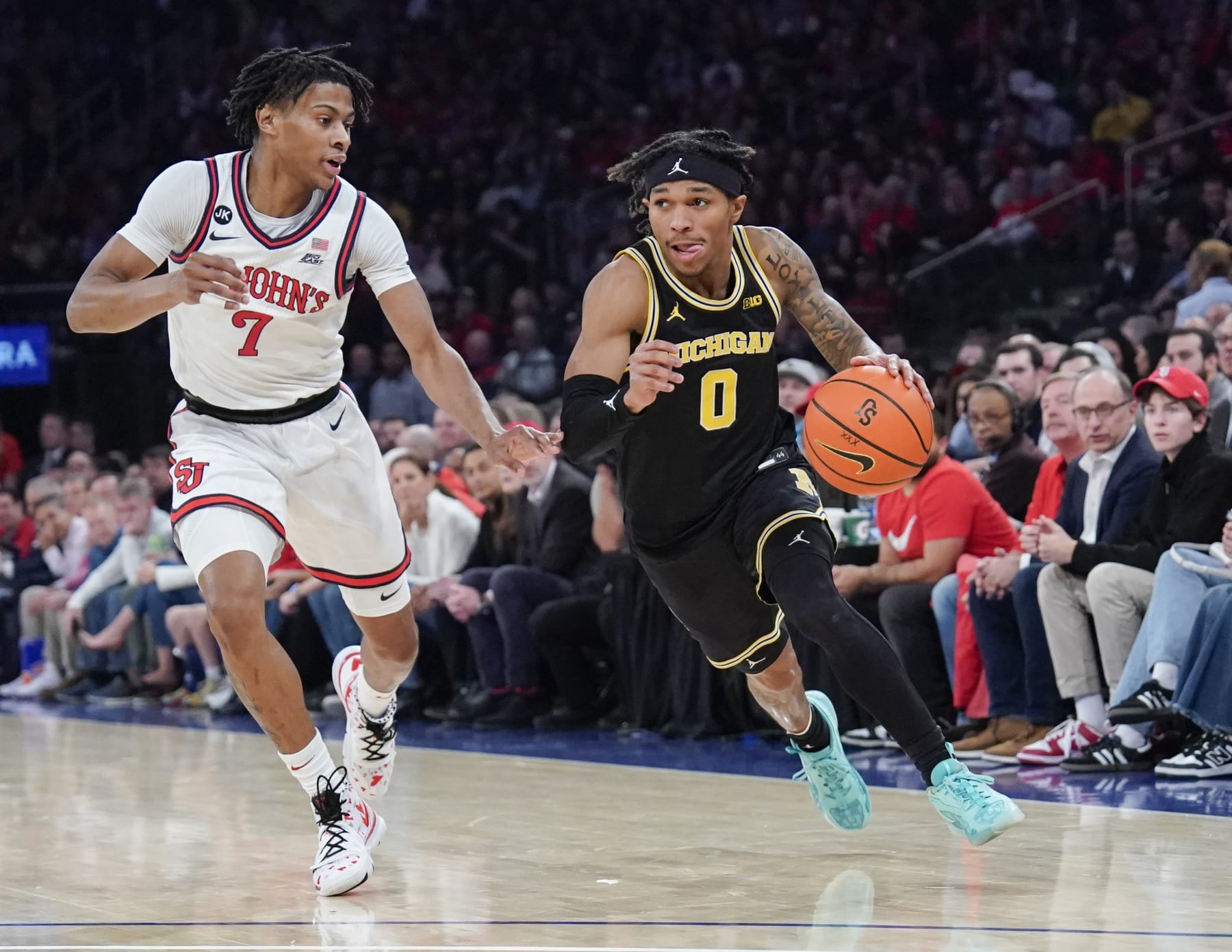 NEW YORK, NY - NOVEMBER 13: Dug McDaniel #0 of the Michigan Wolverines dribbles the ball in first half action against the St. John's Red Storm at Madison Square Garden on November 13, 2023 in New York City. (Photo by Porter Binks).
