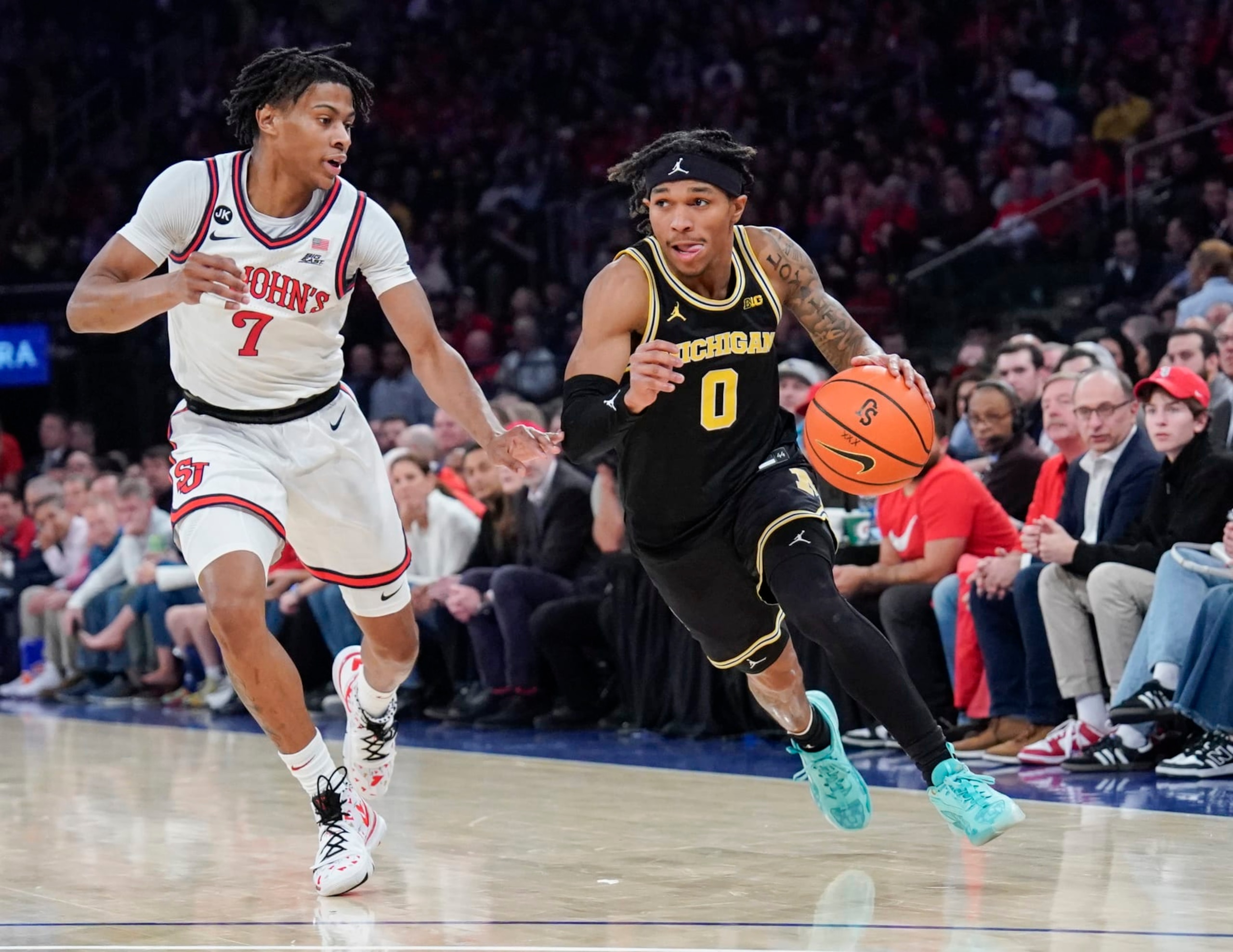NEW YORK, NY - NOVEMBER 13: Dug McDaniel #0 of the Michigan Wolverines dribbles the ball in first half action against the St. John's Red Storm at Madison Square Garden on November 13, 2023 in New York City. (Photo by Porter Binks).