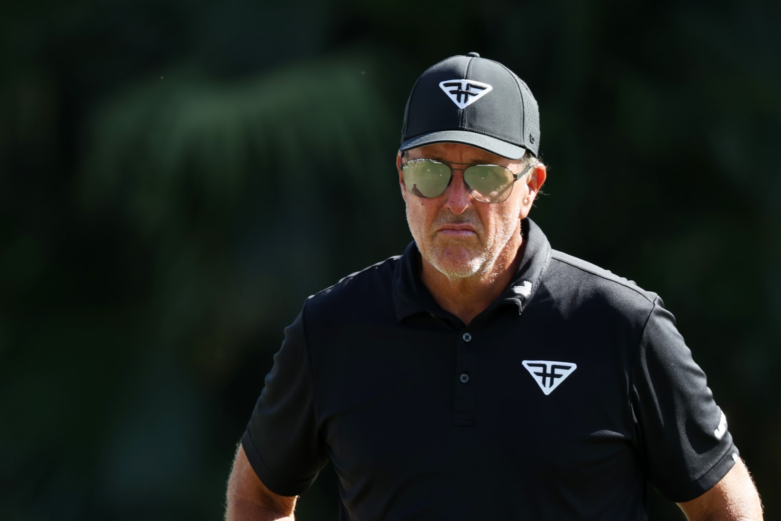 DORAL, FLORIDA - OCTOBER 21:  Captain Phil Mickelson of HyFlyers GC looks on from the 11th green during Day Two of the LIV Golf Invitational - Miami at Trump National Doral Miami on October 21, 2023 in Doral, Florida. (Photo by Cliff Hawkins/Getty Images)