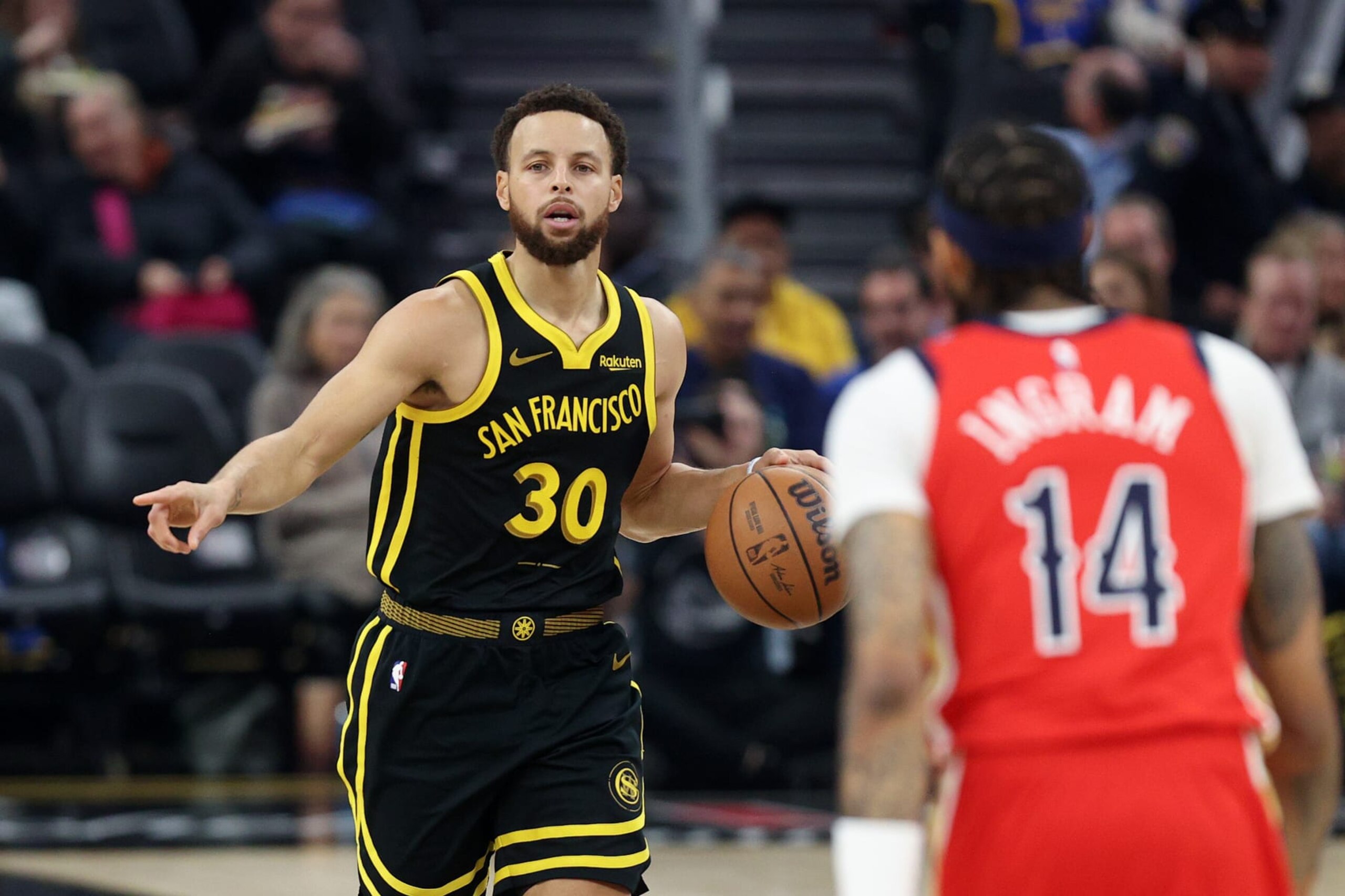SAN FRANCISCO, CALIFORNIA - JANUARY 10: Stephen Curry #30 of the Golden State Warriors is guarded by Brandon Ingram #14 of the New Orleans Pelicans at Chase Center on January 10, 2024 in San Francisco, California. NOTE TO USER: User expressly acknowledges and agrees that, by downloading and or using this photograph, User is consenting to the terms and conditions of the Getty Images License Agreement. (Photo by Ezra Shaw/Getty Images) SAN FRANCISCO, CALIFORNIA - JANUARY 10: Stephen Curry #30 of the Golden State Warriors is guarded by Brandon Ingram #14 of the New Orleans Pelicans at Chase Center on January 10, 2024 in San Francisco, California. NOTE TO USER: User expressly acknowledges and agrees that, by downloading and or using this photograph, User is consenting to the terms and conditions of the Getty Images License Agreement. (Photo by Ezra Shaw/Getty Images)