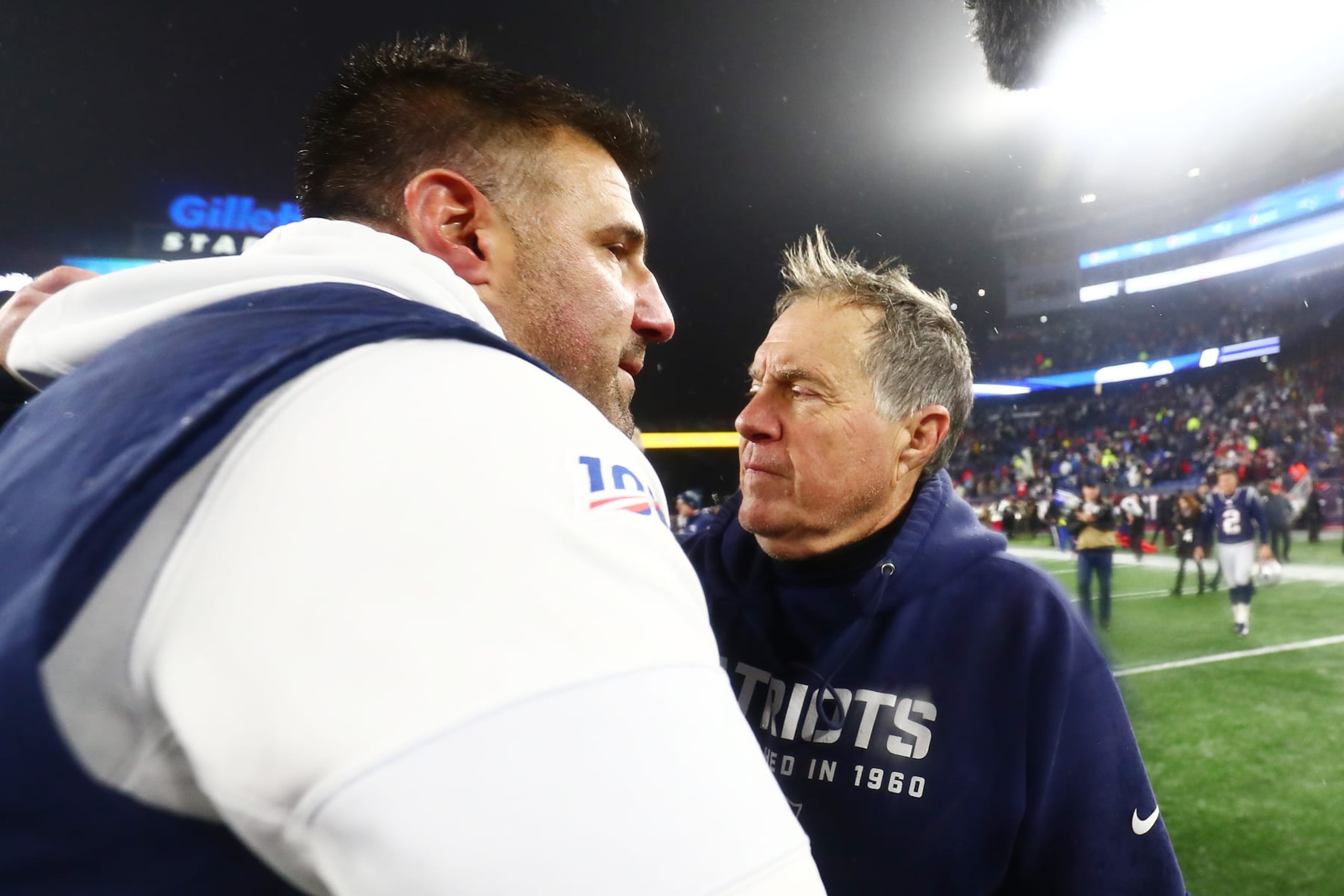 FOXBOROUGH, MASSACHUSETTS - JANUARY 04: Head coach Mike Vrabel of the Tennessee Titans is congratulated by head coach Bill Belichick of the New England Patriots after their 20-13 win in the AFC Wild Card Playoff game at Gillette Stadium on January 04, 2020 in Foxborough, Massachusetts. (Photo by Adam Glanzman/Getty Images) FOXBOROUGH, MASSACHUSETTS - JANUARY 04: Head coach Mike Vrabel of the Tennessee Titans is congratulated by head coach Bill Belichick of the New England Patriots after their 20-13 win in the AFC Wild Card Playoff game at Gillette Stadium on January 04, 2020 in Foxborough, Massachusetts. (Photo by Adam Glanzman/Getty Images)