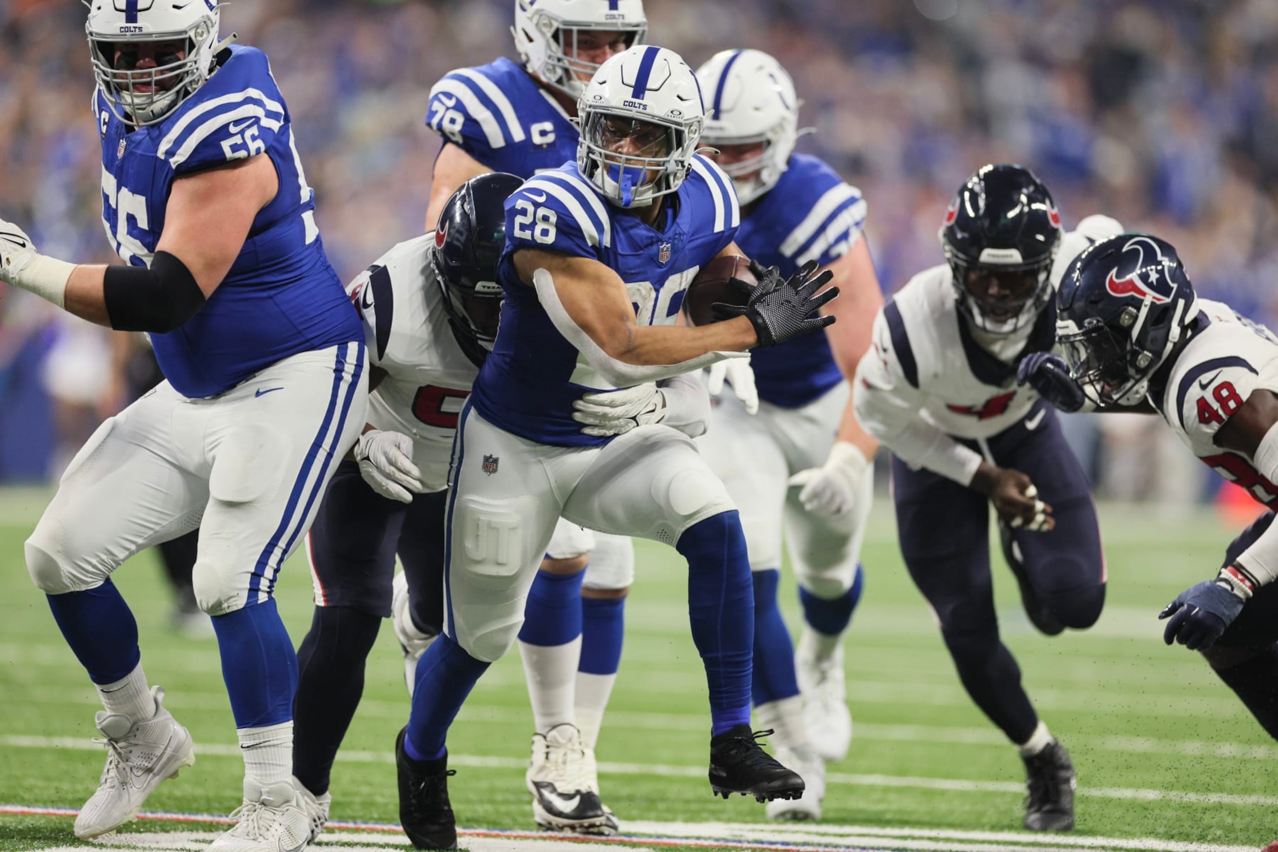 INDIANAPOLIS, INDIANA - JANUARY 06: Jonathan Taylor #28 of the Indianapolis Colts runs with the ball during the first quarter against the Houston Texans at Lucas Oil Stadium on January 06, 2024 in Indianapolis, Indiana. (Photo by Andy Lyons/Getty Images)