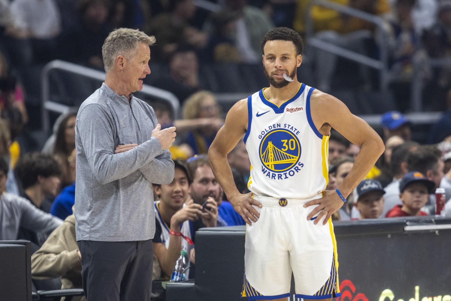 LOS ANGELES, CA - DECEMBER 02: Golden State Warriors head coach Steve Kerr talks with Golden State Warriors guard Stephen Curry (30) courtside during a break in the first half of an NBA basketball game between the Golden State Warriors and Los Angeles Clippers, Saturday, December 2, 2023, at Crypto.com Arena in Los Angeles, California. (Photo by Tony Ding/Icon Sportswire via Getty Images)