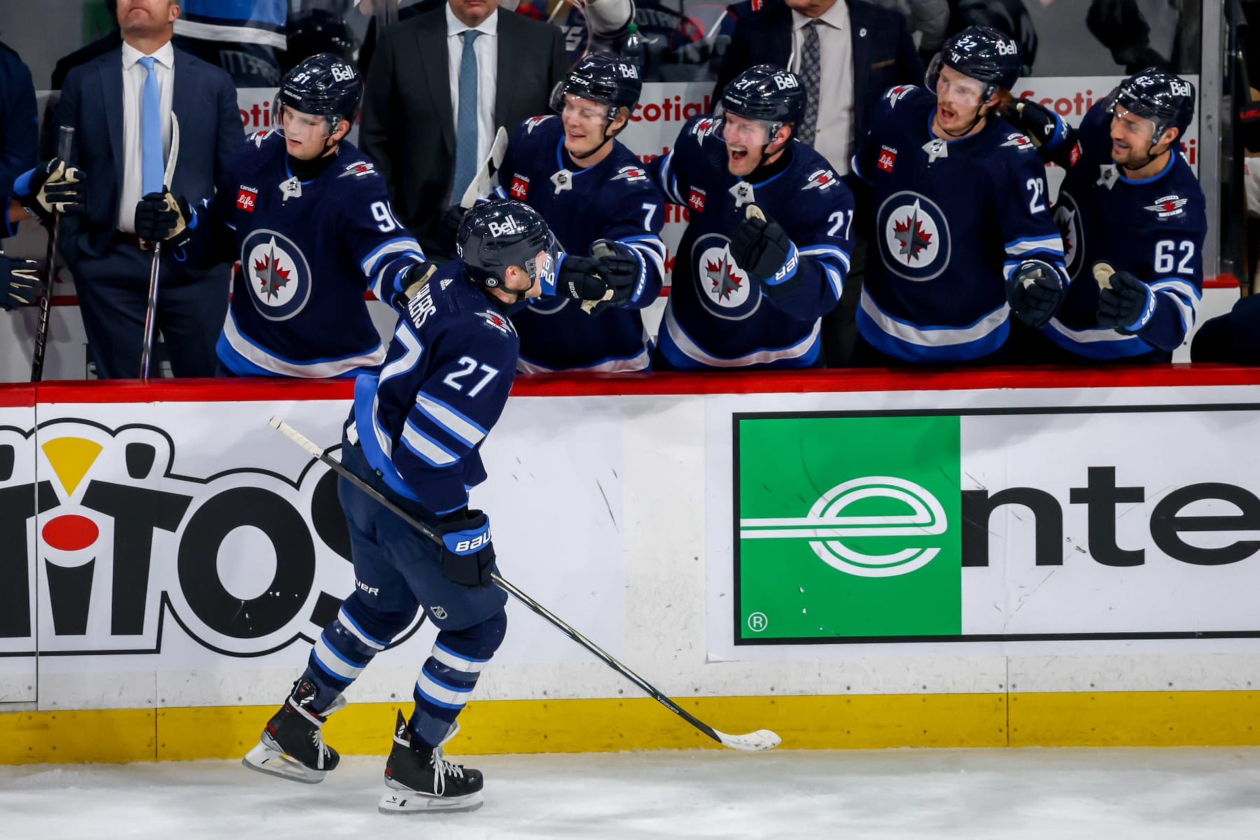 WINNIPEG, CANADA - JANUARY 11: Nikolaj Ehlers #27 of the Winnipeg Jets celebrates his third period goal against the Chicago Blackhawks with teammates at the bench at the Canada Life Centre on January 11, 2024 in Winnipeg, Manitoba, Canada. (Photo by Jonathan Kozub/NHLI via Getty Images)