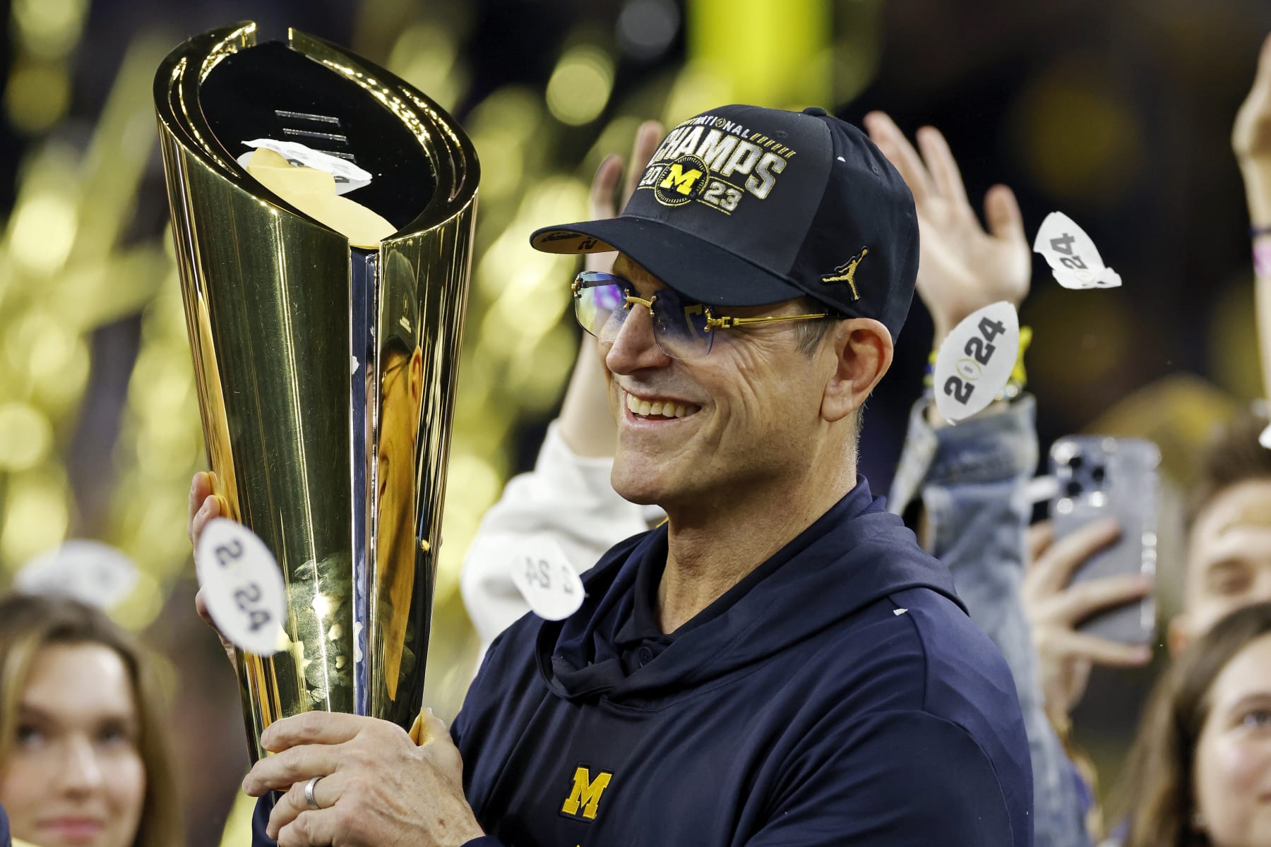 HOUSTON, TX - JANUARY 08: Michigan Wolverines head coach Jim Harbaugh celebrates following the CFP National Championship against the Washington Huskies on January 08, 2024 at NRG Stadium in Houston, Texas. (Photo by Joe Robbins/Icon Sportswire via Getty Images)