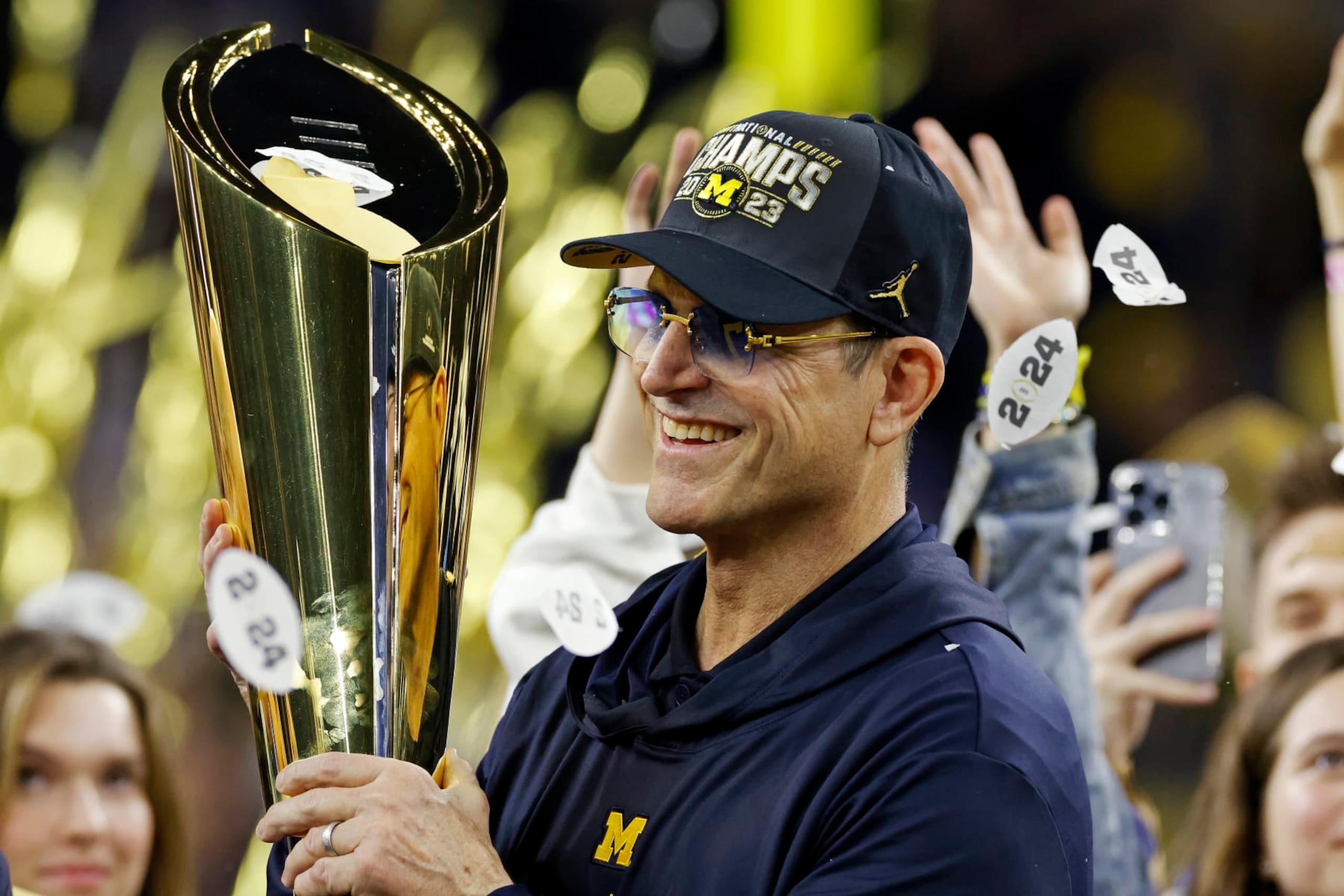 HOUSTON, TX - JANUARY 08: Michigan Wolverines head coach Jim Harbaugh celebrates following the CFP National Championship against the Washington Huskies on January 08, 2024 at NRG Stadium in Houston, Texas. (Photo by Joe Robbins/Icon Sportswire via Getty Images)