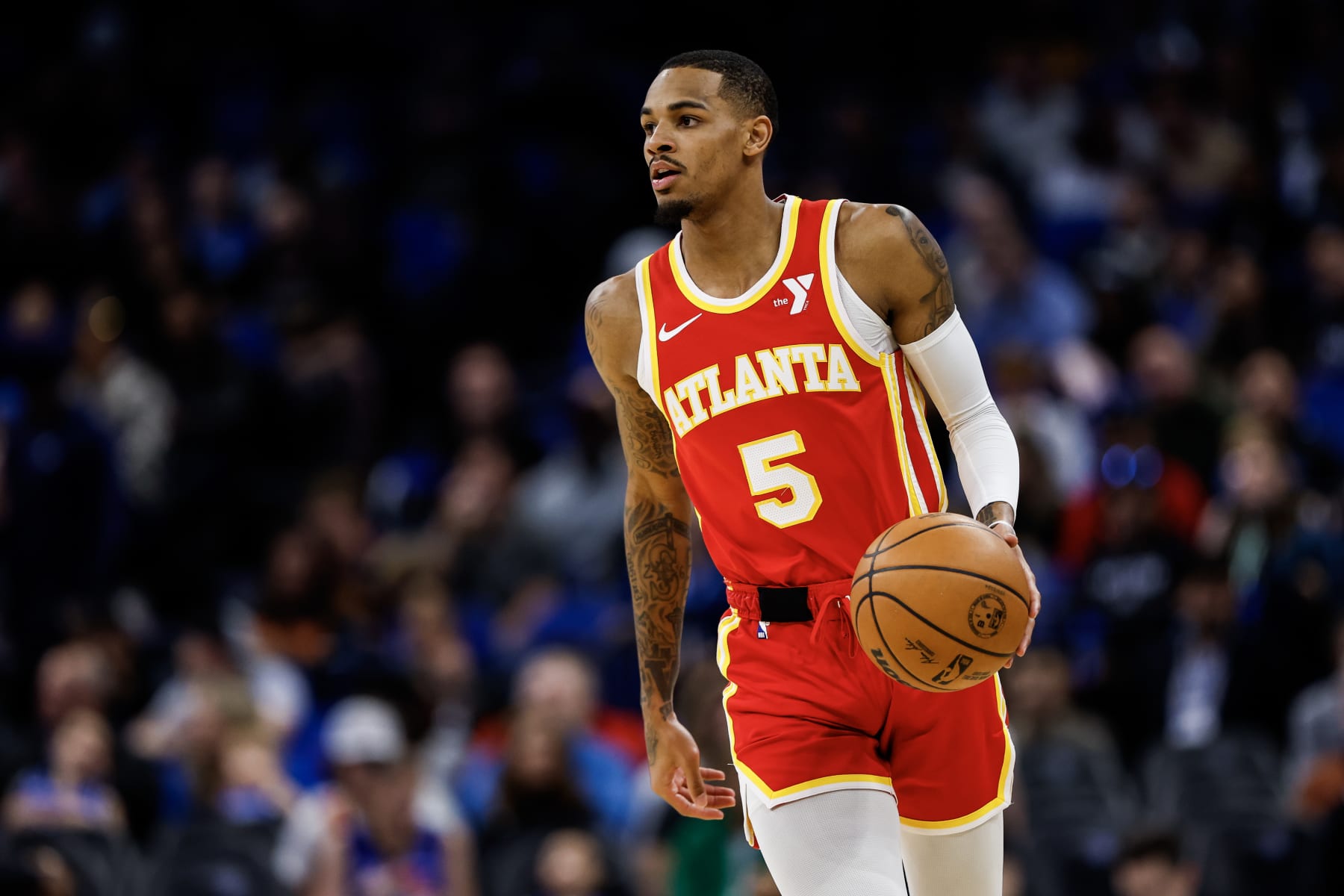 ORLANDO, FLORIDA - JANUARY 07: Dejounte Murray #5 of the Atlanta Hawks dribbles the ball during the first half of a game against the Orlando Magic at the Kia Center on January 07, 2024 in Orlando, Florida. NOTE TO USER: User expressly acknowledges and agrees that, by downloading and or using this photograph, User is consenting to the terms and conditions of the Getty Images License Agreement. (Photo by James Gilbert/Getty Images)