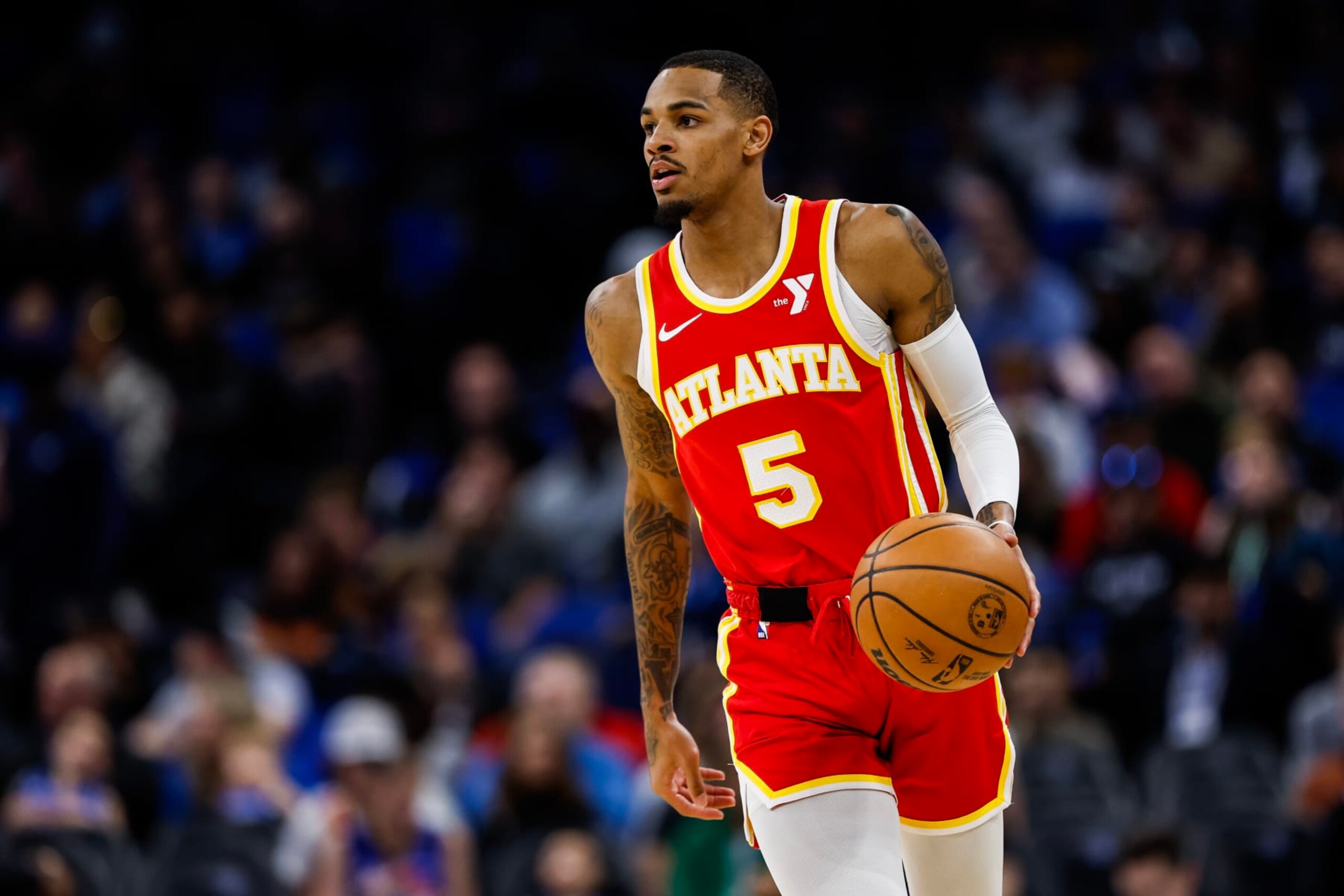 ORLANDO, FLORIDA - JANUARY 07: Dejounte Murray #5 of the Atlanta Hawks dribbles the ball during the first half of a game against the Orlando Magic at the Kia Center on January 07, 2024 in Orlando, Florida. NOTE TO USER: User expressly acknowledges and agrees that, by downloading and or using this photograph, User is consenting to the terms and conditions of the Getty Images License Agreement. (Photo by James Gilbert/Getty Images)