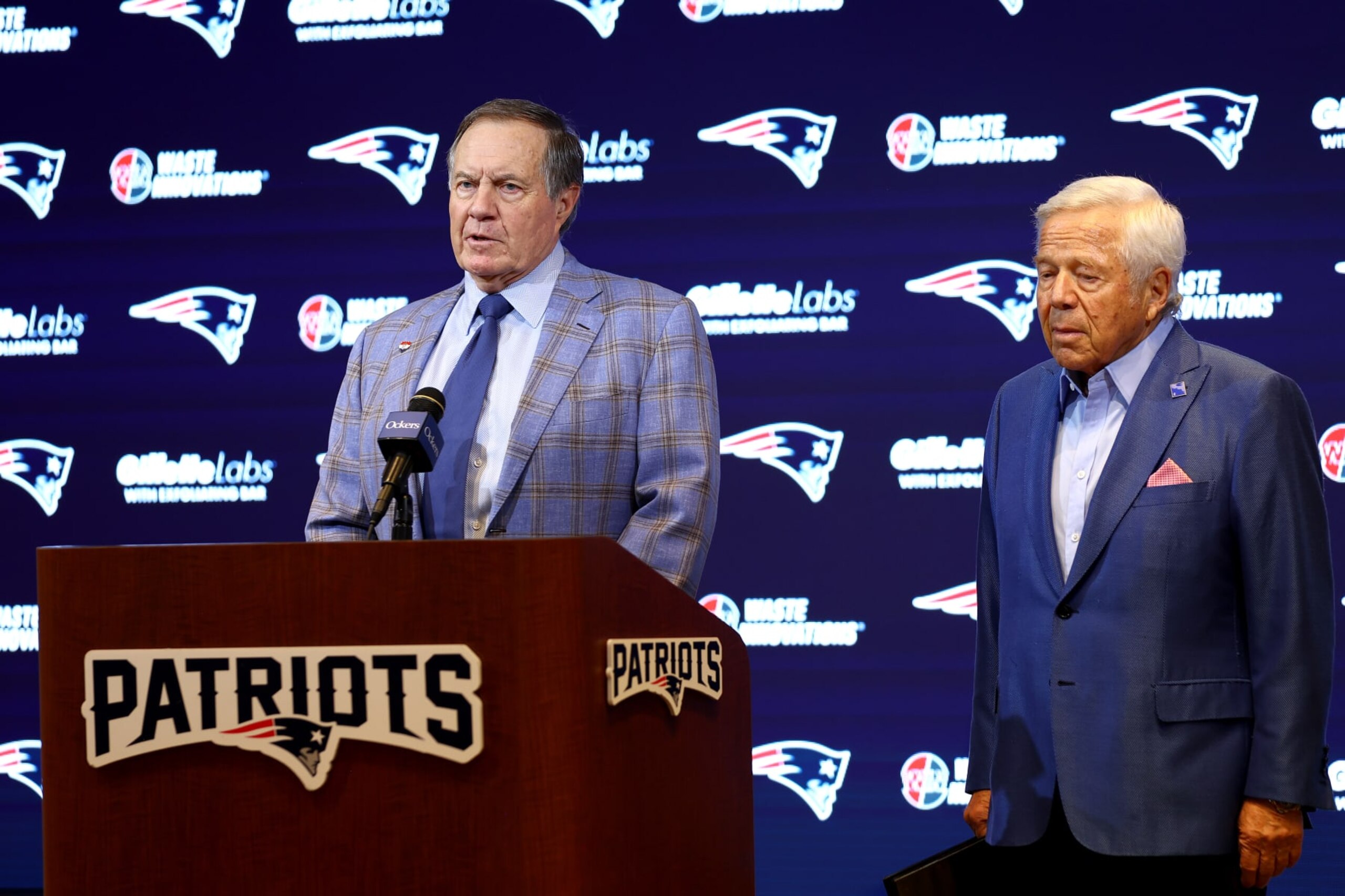 FOXBOROUGH, MASSACHUSETTS - JANUARY 11: Head coach Bill Belichick (L) of the New England Patriots speaks to the media as owner Robert Kraft (R) looks on during a press conference at Gillette Stadium on January 11, 2024 in Foxborough, Massachusetts. Belichick announced he is stepping down as head coach after 24 seasons with the team. (Photo by Maddie Meyer/Getty Images) FOXBOROUGH, MASSACHUSETTS - JANUARY 11: Head coach Bill Belichick (L) of the New England Patriots speaks to the media as owner Robert Kraft (R) looks on during a press conference at Gillette Stadium on January 11, 2024 in Foxborough, Massachusetts. Belichick announced he is stepping down as head coach after 24 seasons with the team. (Photo by Maddie Meyer/Getty Images)