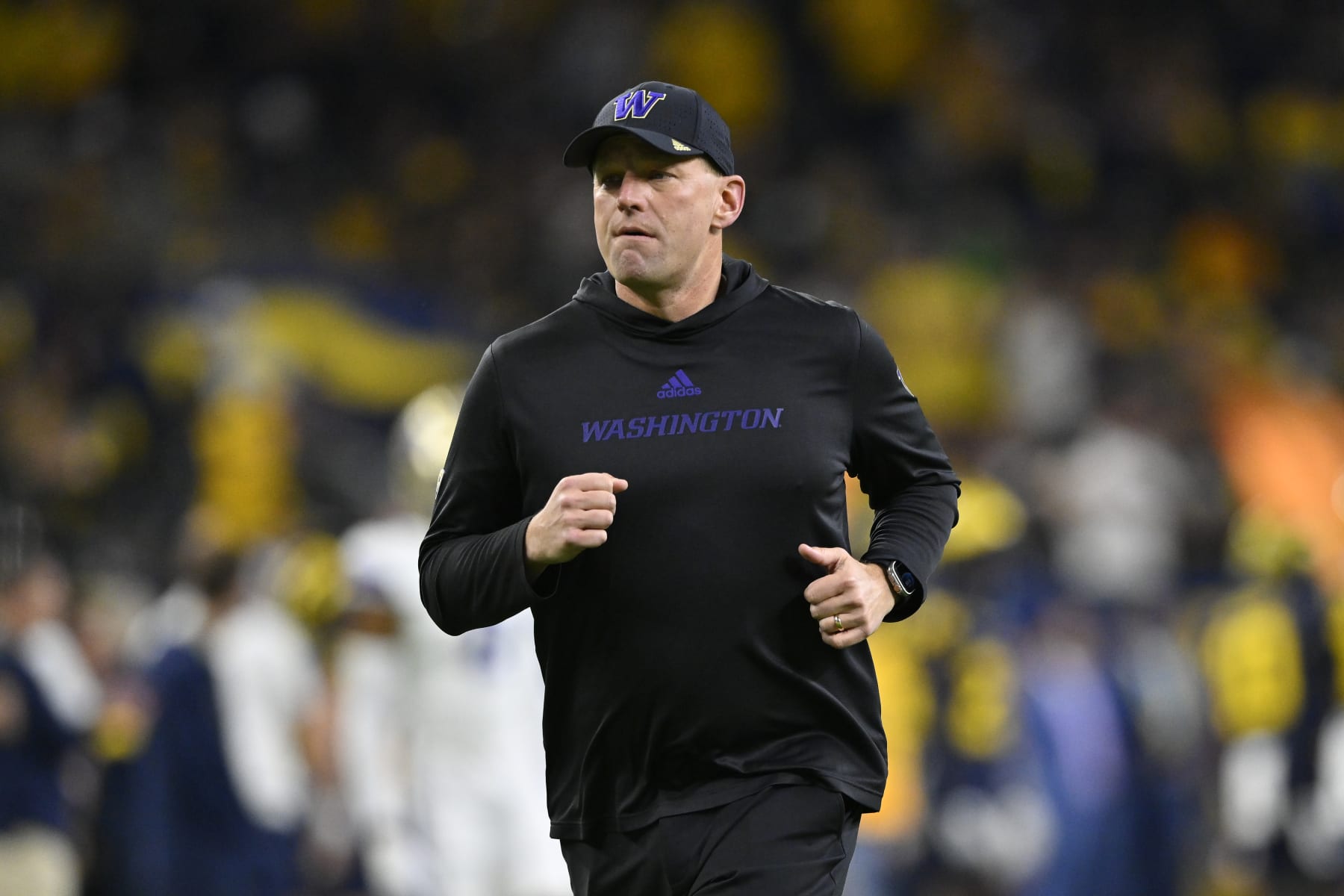 HOUSTON, TEXAS - JANUARY 08: Head coach Kalen DeBoer of the Washington Huskies runs on the field before the 2024 CFP National Championship game against the Michigan Wolverines at NRG Stadium on January 08, 2024 in Houston, Texas. The Michigan Wolverines won 34-13. (Photo by Alika Jenner/Getty Images)