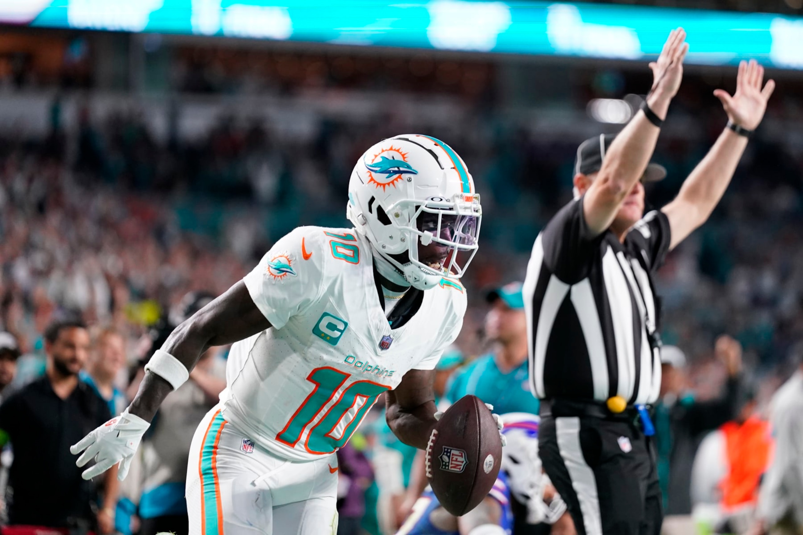 MIAMI GARDENS, FLORIDA - JANUARY 07: Tyreek Hill #10 of the Miami Dolphins celebrates after a touchdown during the second quarter against the Buffalo Bills at Hard Rock Stadium on January 07, 2024 in Miami Gardens, Florida. (Photo by Rich Storry/Getty Images)