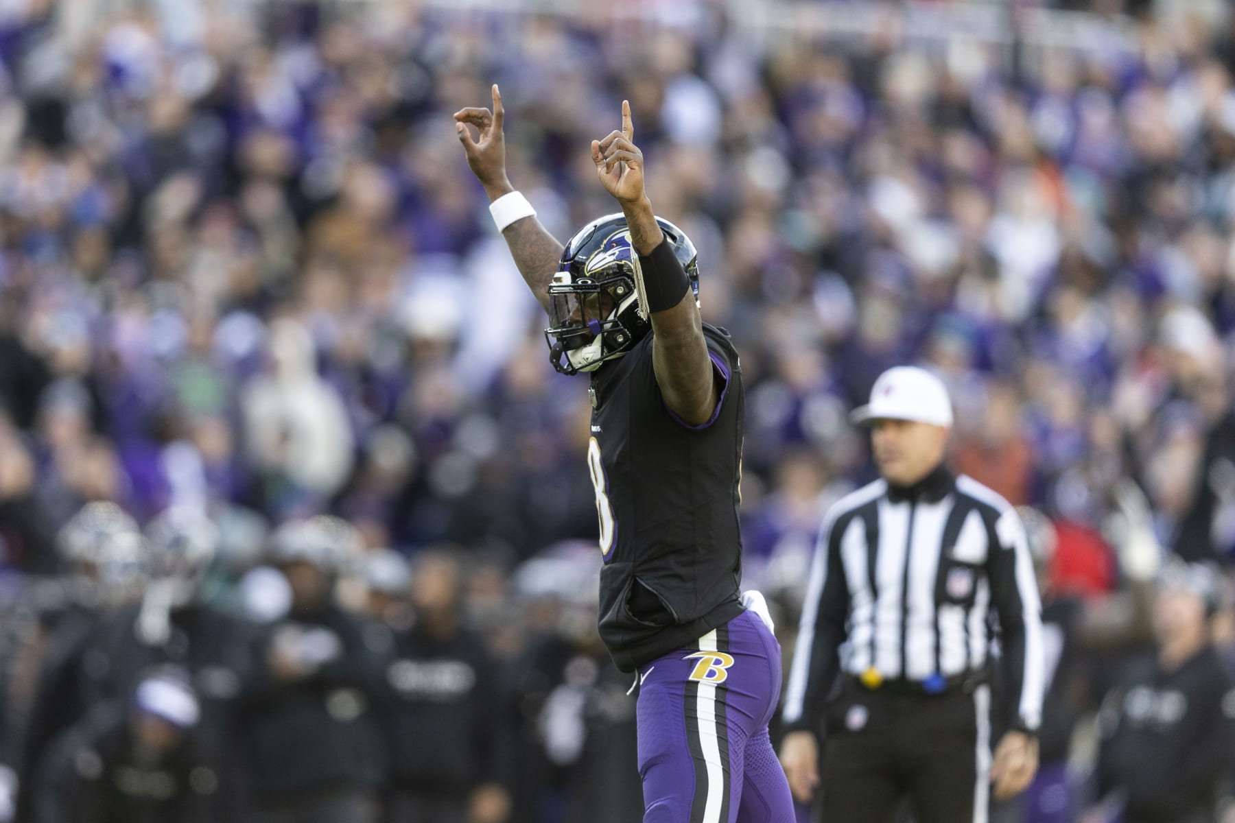 BALTIMORE, MARYLAND - DECEMBER 31: Lamar Jackson #8 of the Baltimore Ravens celebrates after a touchdown during an NFL football game between the Baltimore Ravens and the Miami Dolphins at M&T Bank Stadium on December 31, 2023 in Baltimore, Maryland. (Photo by Michael Owens/Getty Images)