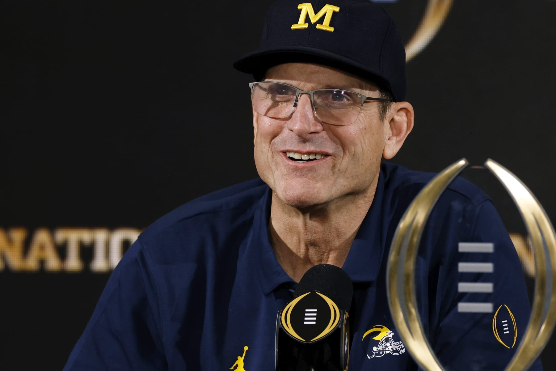 HOUSTON, TX - JANUARY 08: Michigan Wolverines head coach Jim Harbaugh speaks to the media following the CFP National Championship against the Washington Huskies on January 08, 2024 at NRG Stadium in Houston, Texas. (Photo by Joe Robbins/Icon Sportswire via Getty Images)