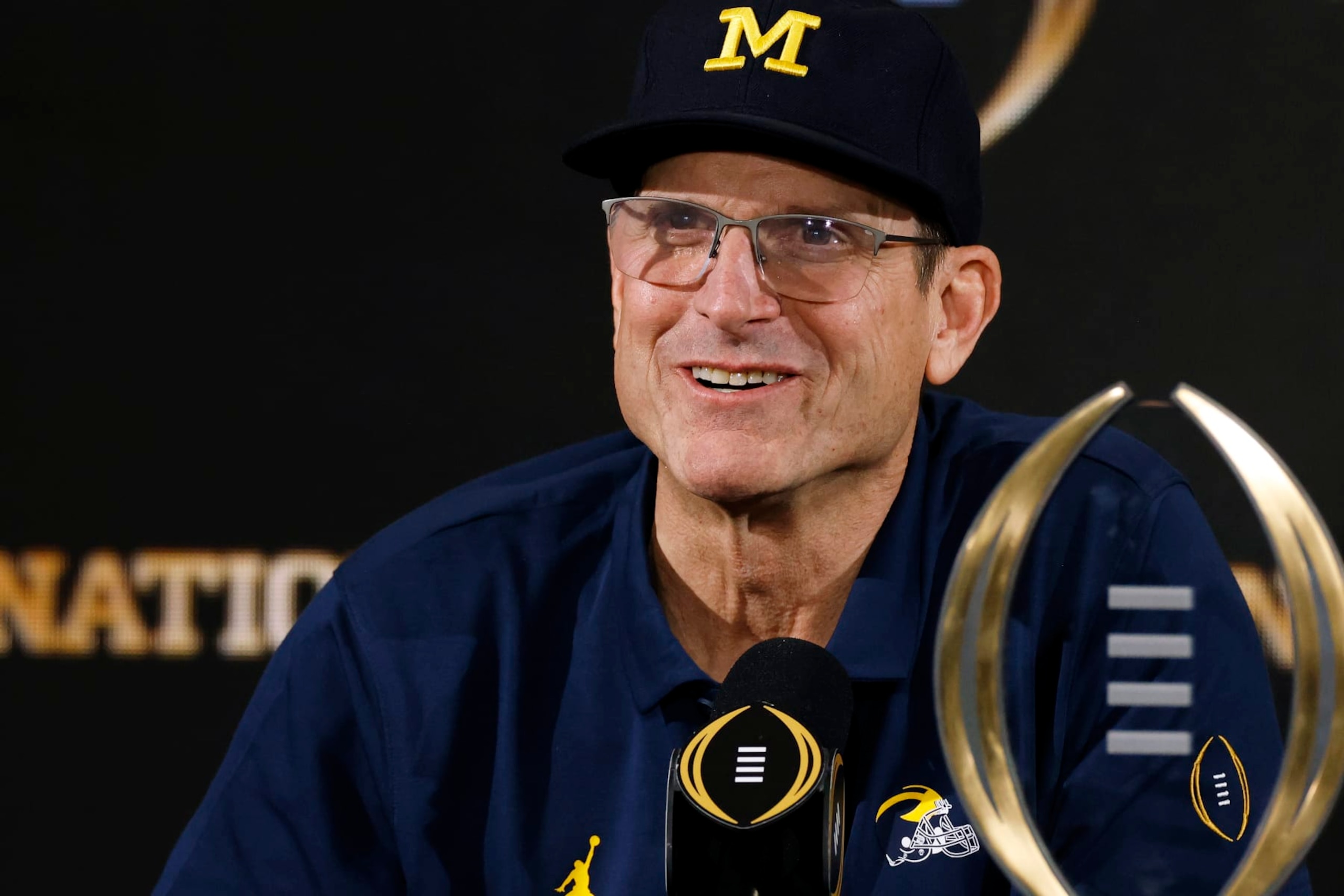 HOUSTON, TX - JANUARY 08: Michigan Wolverines head coach Jim Harbaugh speaks to the media following the CFP National Championship against the Washington Huskies on January 08, 2024 at NRG Stadium in Houston, Texas. (Photo by Joe Robbins/Icon Sportswire via Getty Images) HOUSTON, TX - JANUARY 08: Michigan Wolverines head coach Jim Harbaugh speaks to the media following the CFP National Championship against the Washington Huskies on January 08, 2024 at NRG Stadium in Houston, Texas. (Photo by Joe Robbins/Icon Sportswire via Getty Images)