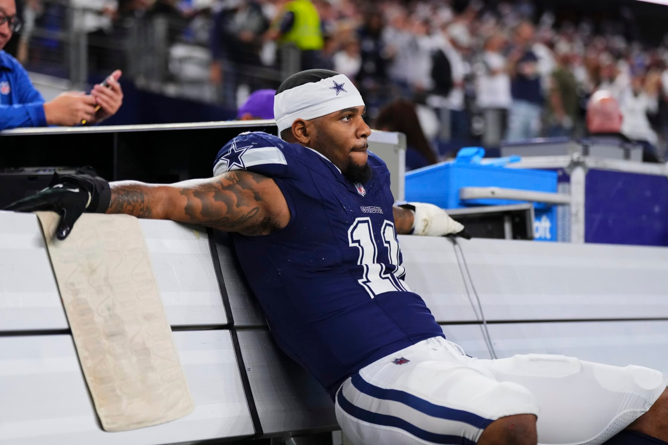 ARLINGTON, TX - DECEMBER 30: Micah Parsons #11 of the Dallas Cowboys sits on the bench after defeating the Detroit Lions at AT&T Stadium on December 30, 2023 in Arlington, Texas. (Photo by Cooper Neill/Getty Images)