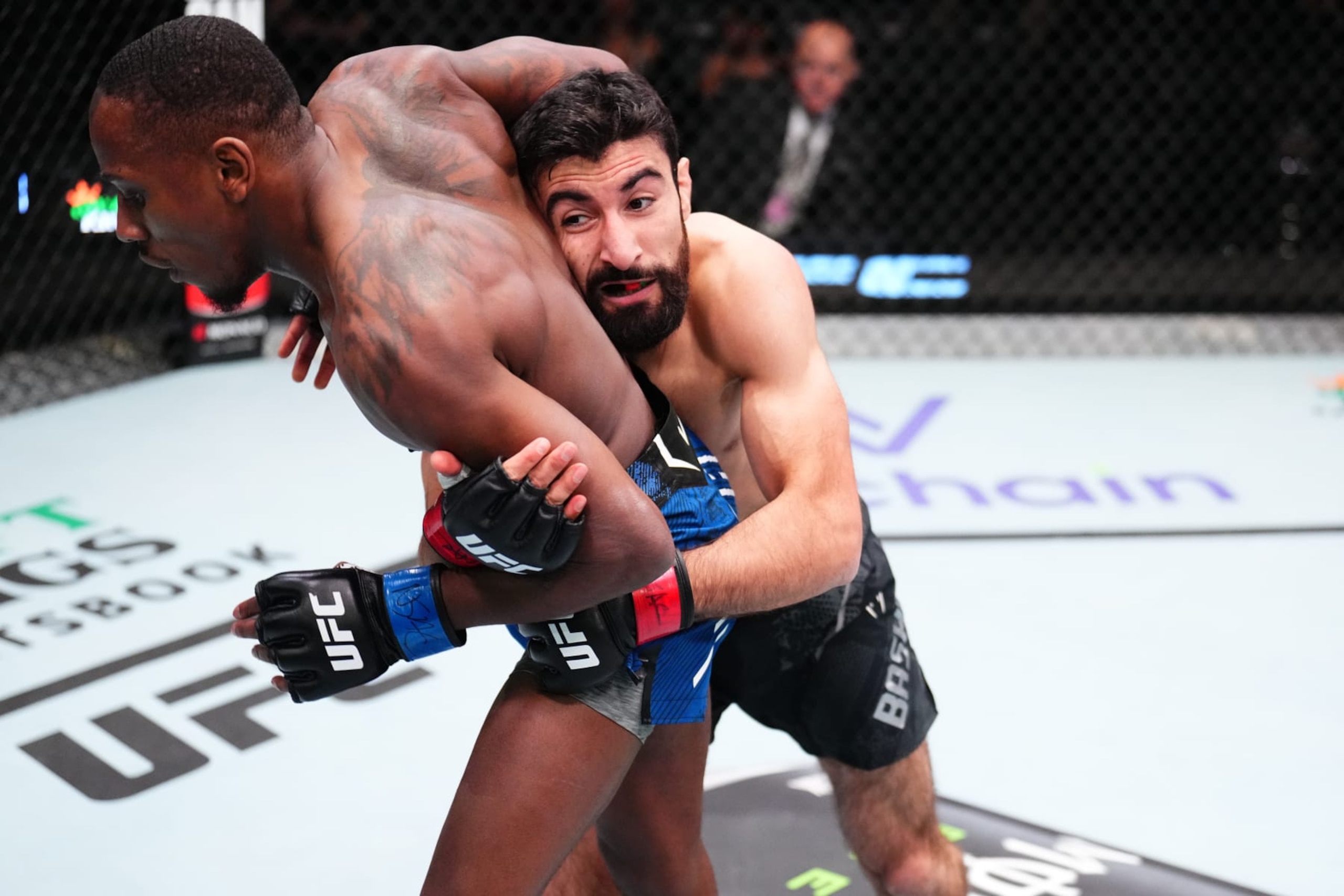 LAS VEGAS, NEVADA - JANUARY 13: (R-L) Farid Basharat of Afghanistan attempts to take down Taylor Lapilus of France in a bantamweight fight during the UFC Fight Night event at UFC APEX on January 13, 2024 in Las Vegas, Nevada. (Photo by Chris Unger/Zuffa LLC via Getty Images)