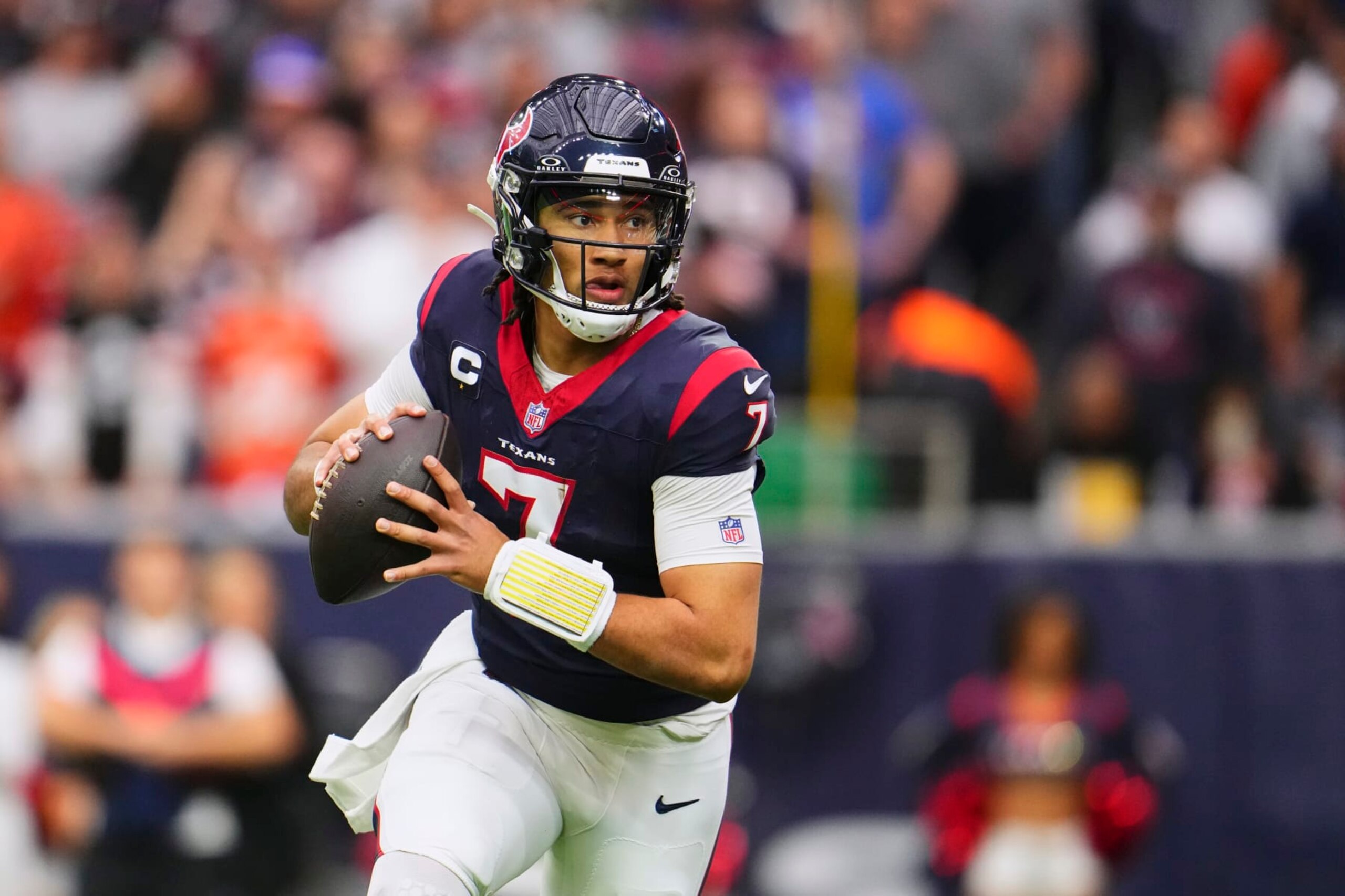 HOUSTON, TX - JANUARY 13: C.J. Stroud #7 of the Houston Texans drops back to pass against the Cleveland Browns during the first half of the AFC Wild Card playoff game at NRG Stadium on January 13, 2024 in Houston, Texas. (Photo by Cooper Neill/Getty Images) HOUSTON, TX - JANUARY 13: C.J. Stroud #7 of the Houston Texans drops back to pass against the Cleveland Browns during the first half of the AFC Wild Card playoff game at NRG Stadium on January 13, 2024 in Houston, Texas. (Photo by Cooper Neill/Getty Images)