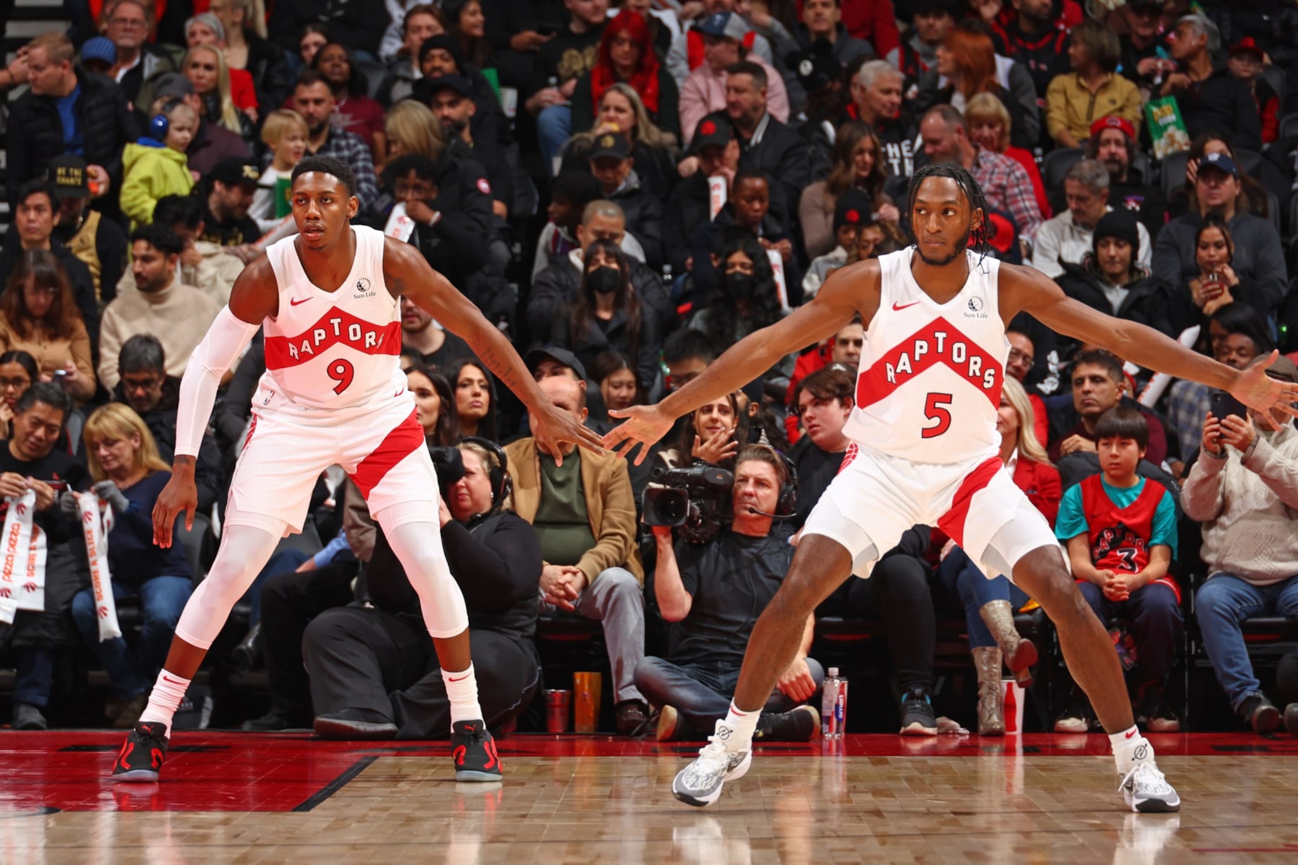 TORONTO, CANADA - JANUARY 1: RJ Barrett #9 of the Toronto Raptors and Immanuel Quickley #5 of the Toronto Raptors play defense against the Cleveland Cavaliers on January 1, 2024 at the Scotiabank Arena in Toronto, Ontario, Canada.  NOTE TO USER: User expressly acknowledges and agrees that, by downloading and or using this Photograph, user is consenting to the terms and conditions of the Getty Images License Agreement.  Mandatory Copyright Notice: Copyright 2024 NBAE (Photo by Vaughn Ridley/NBAE via Getty Images)