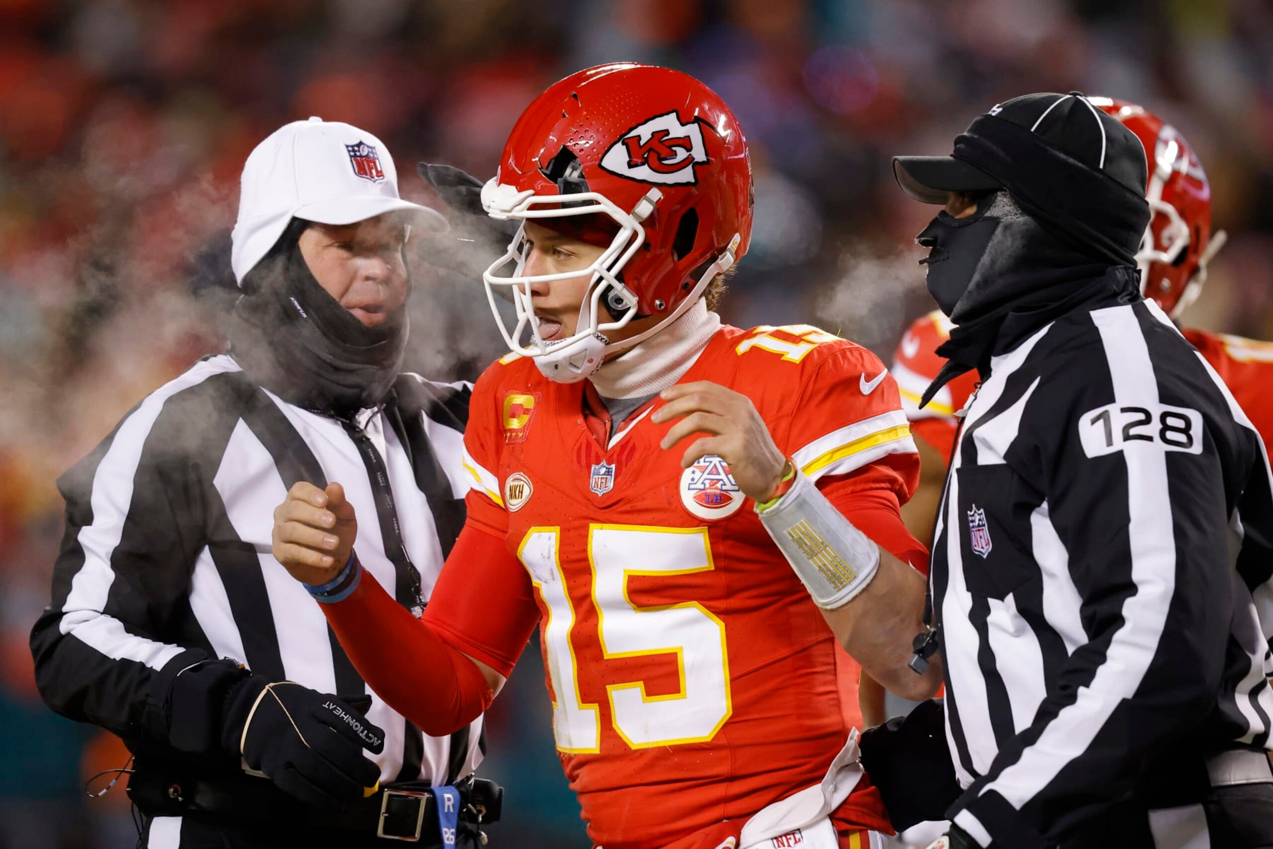 KANSAS CITY, MISSOURI - JANUARY 13: Patrick Mahomes #15 of the Kansas City Chiefs heads to the sideline after his helmet was cracked during the third quarter in the AFC Wild Card Playoffs against the Miami Dolphinsat GEHA Field at Arrowhead Stadium on January 13, 2024 in Kansas City, Missouri. (Photo by David Eulitt/Getty Images) KANSAS CITY, MISSOURI - JANUARY 13: Patrick Mahomes #15 of the Kansas City Chiefs heads to the sideline after his helmet was cracked during the third quarter in the AFC Wild Card Playoffs against the Miami Dolphinsat GEHA Field at Arrowhead Stadium on January 13, 2024 in Kansas City, Missouri. (Photo by David Eulitt/Getty Images)