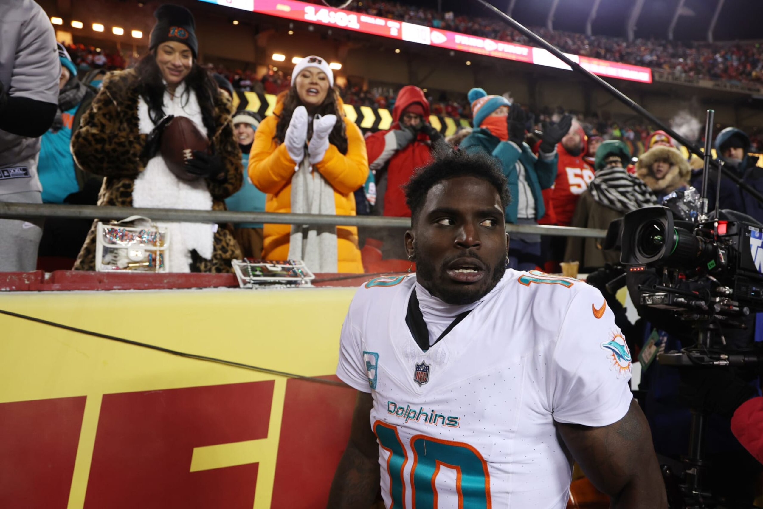 KANSAS CITY, MISSOURI - JANUARY 13: Tyreek Hill #10 of the Miami Dolphins celebrates after scoring a touchdown during the second quarter against the Kansas City Chiefs in the AFC Wild Card Playoffs at GEHA Field at Arrowhead Stadium on January 13, 2024 in Kansas City, Missouri. (Photo by Jamie Squire/Getty Images)