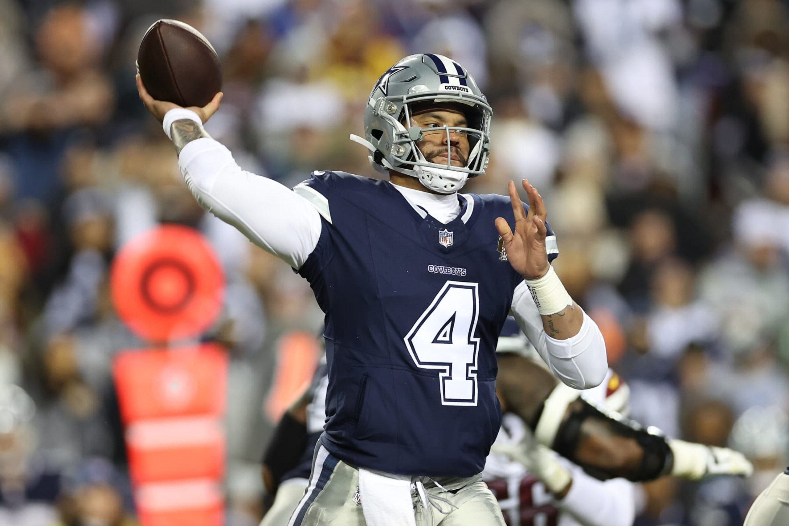 LANDOVER, MARYLAND - JANUARY 07: Dak Prescott #4 of the Dallas Cowboys attempts to pass during the second quarter against the Washington Commanders at FedExField on January 07, 2024 in Landover, Maryland. (Photo by Scott Taetsch/Getty Images) LANDOVER, MARYLAND - JANUARY 07: Dak Prescott #4 of the Dallas Cowboys attempts to pass during the second quarter against the Washington Commanders at FedExField on January 07, 2024 in Landover, Maryland. (Photo by Scott Taetsch/Getty Images)