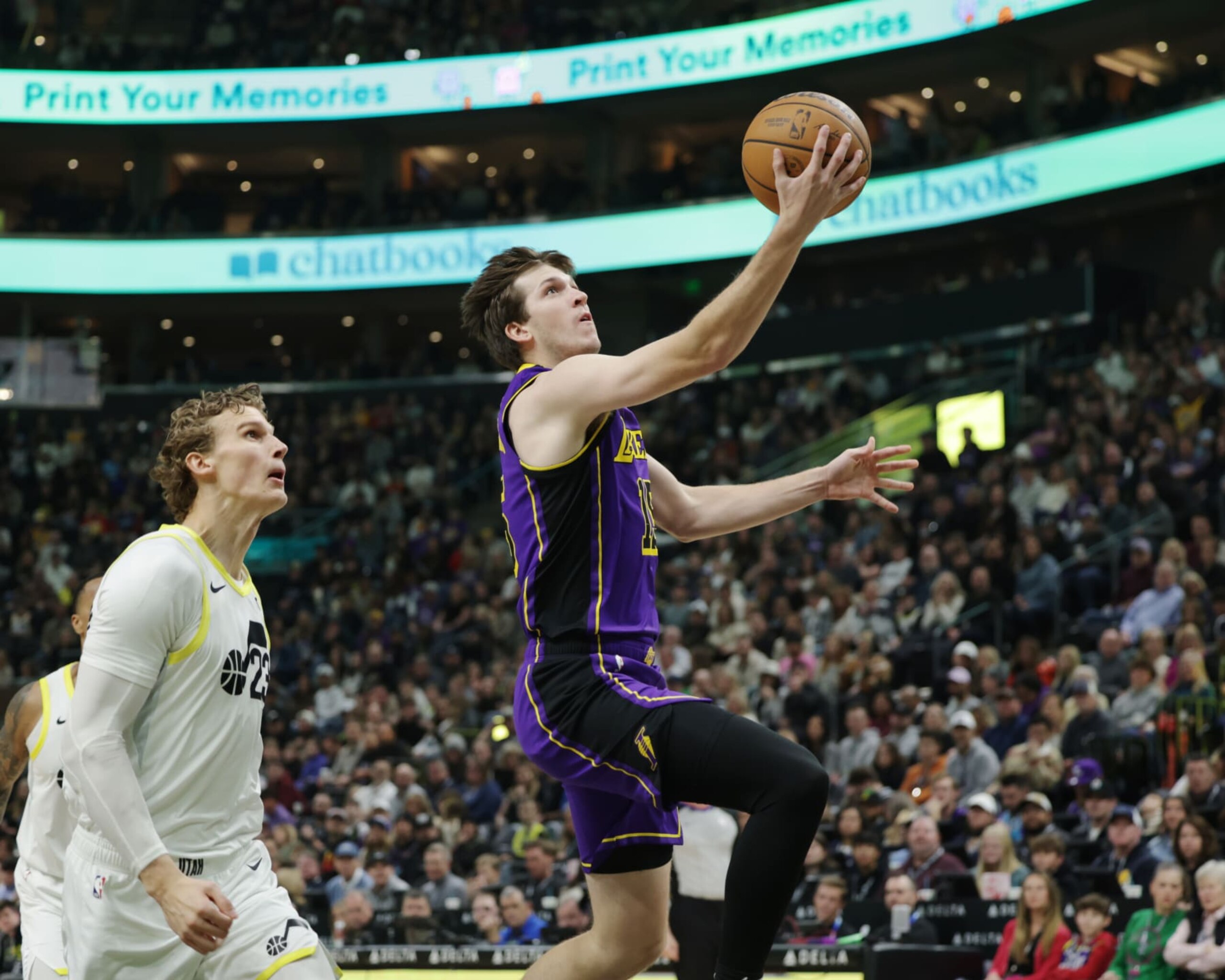 SALT LAKE CITY, UT - JANUARY 13: Austin Reaves #15 of the Los Angeles Lakers drives to the basket during the game against the Utah Jazz on January 13, 2024 at vivint.SmartHome Arena in Salt Lake City, Utah. NOTE TO USER: User expressly acknowledges and agrees that, by downloading and or using this Photograph, User is consenting to the terms and conditions of the Getty Images License Agreement. Mandatory Copyright Notice: Copyright 2024 NBAE (Photo by Chris Nicoll/NBAE via Getty Images)