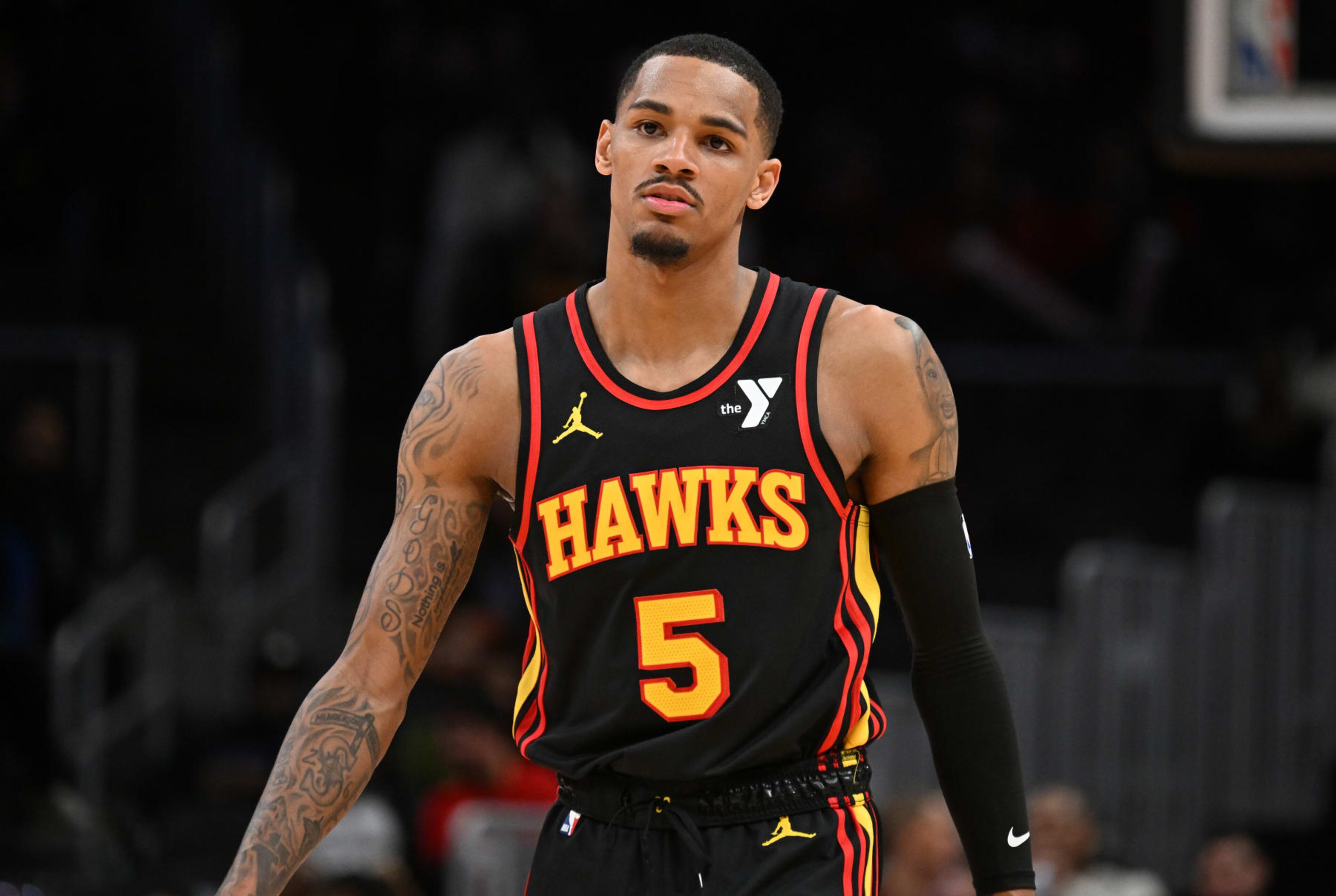 ATLANTA, GEORGIA - JANUARY 12: Dejounte Murray #5 of the Atlanta Hawks looks on during the game against the Indiana Pacers on January 12, 2024 at State Farm Arena in Atlanta, Georgia.  NOTE TO USER: User expressly acknowledges and agrees that, by downloading and or using this photograph, User is consenting to the terms and conditions of the Getty Images License Agreement. (Photo by Paras Griffin/Getty Images)
