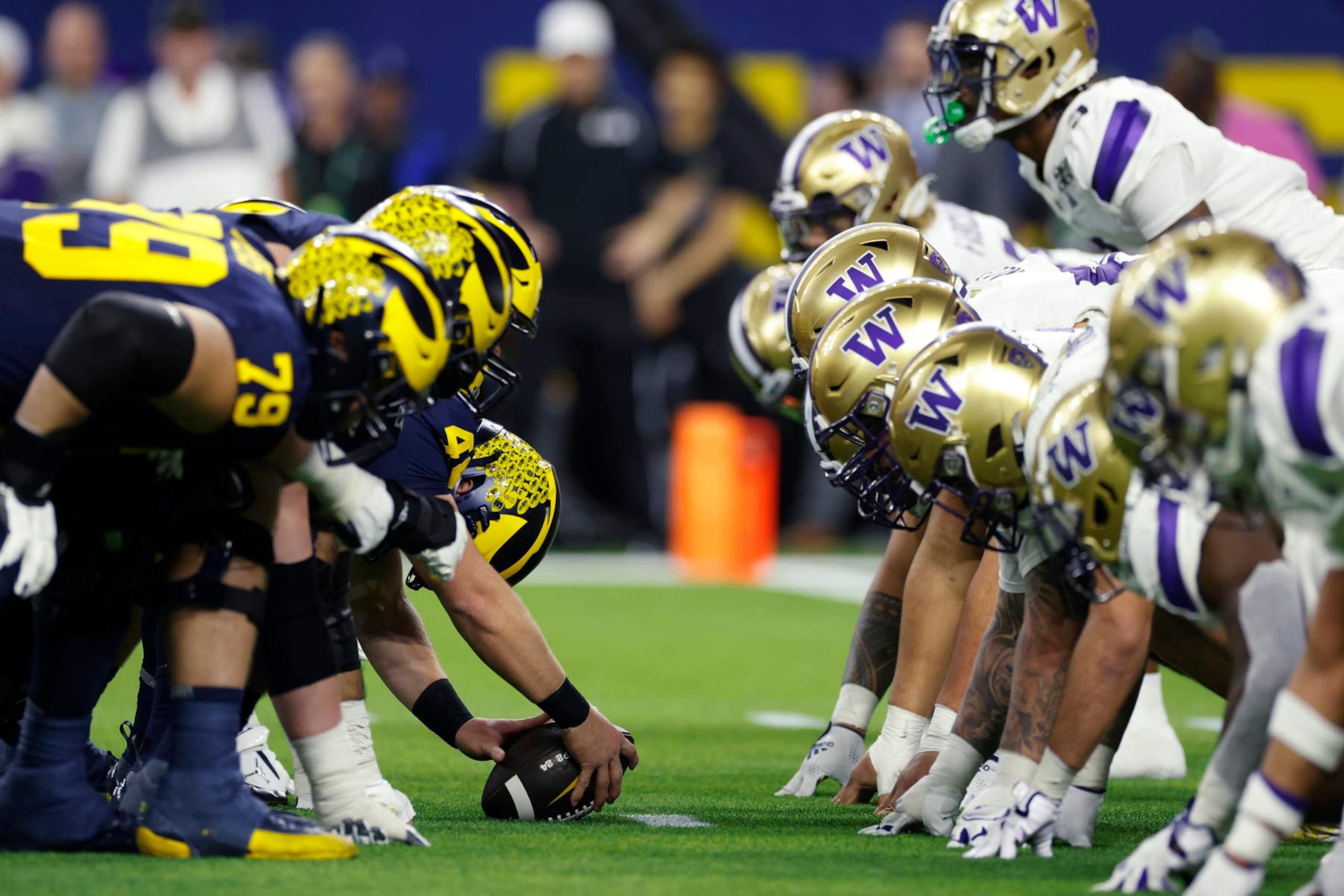 HOUSTON, TX - JANUARY 08: Michigan Wolverines line up at the line of scrimmage against the Washington Huskies during the CFP National Championship on January 08, 2024 at NRG Stadium in Houston, Texas. (Photo by Joe Robbins/Icon Sportswire via Getty Images)
