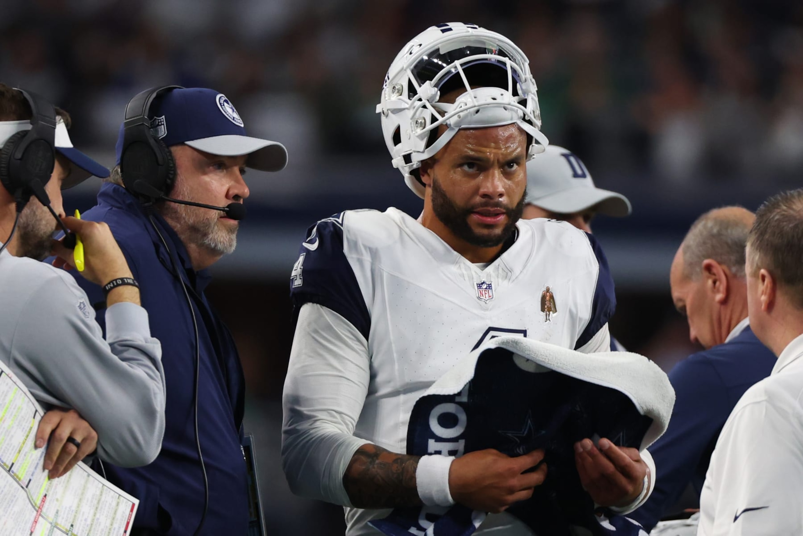 ARLINGTON, TEXAS - DECEMBER 10: Dak Prescott #4 of the Dallas Cowboys and head coach Mike McCarthy are seen on the sideline during the second quarter against the Philadelphia Eagles at AT&T Stadium on December 10, 2023 in Arlington, Texas. (Photo by Richard Rodriguez/Getty Images)