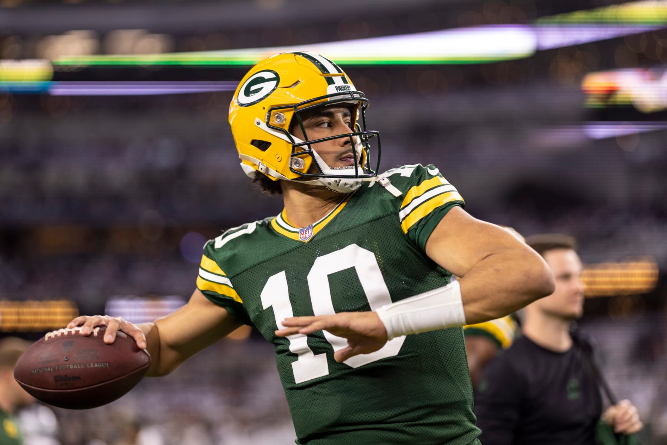 ARLINGTON, TEXAS - JANUARY 14: Jordan Love #10 of the Green Bay Packers throws a pass as he warms up prior to an NFL wild-card playoff football game between the Dallas Cowboys and the Green Bay Packers at AT&T Stadium on January 14, 2024 in Arlington, Texas. (Photo by Michael Owens/Getty Images)