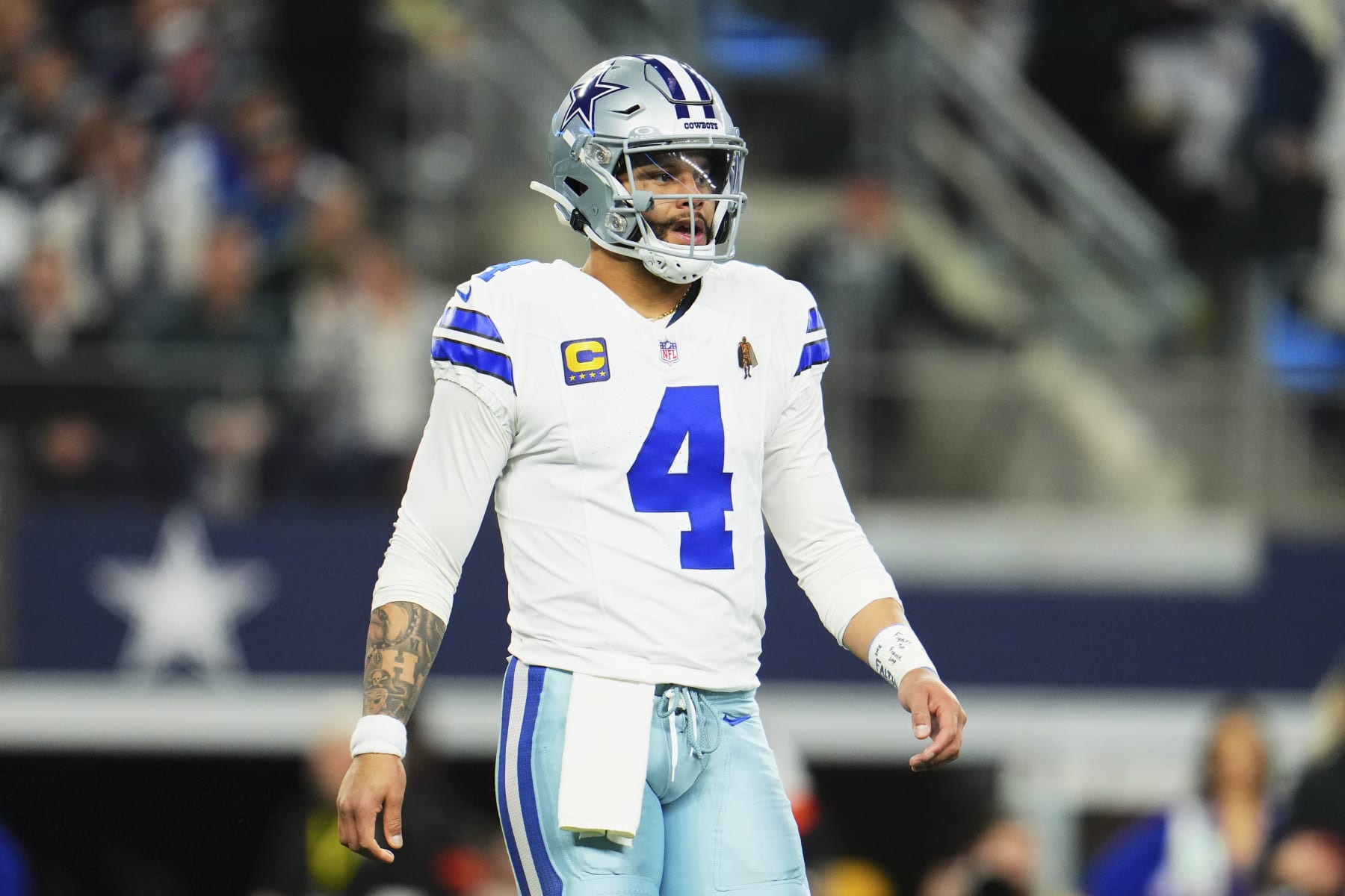 DALLAS, TX - JANUARY 14: Dak Prescott #4 of the Dallas Cowboys looks towards the sideline against the Green Bay Packers during the first half of the NFC Wild Card playoff game at AT&T Stadium on January 14, 2024 in Dallas, Texas. (Photo by Cooper Neill/Getty Images)