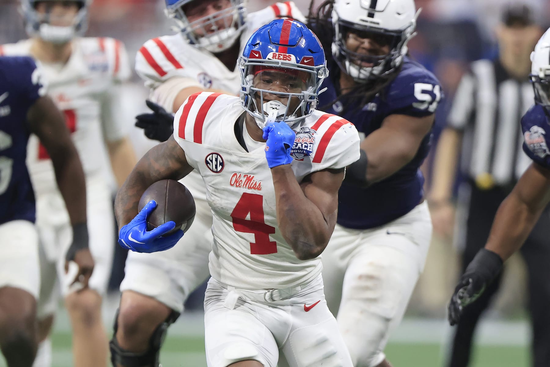 ATLANTA, GA - DECEMBER 30: Mississippi Rebels running back Quinshon Judkins (4) rushes during the Saturday afternoon Chick-fil-A Peach Bowl game between the Penn State Nittany Lions and the Ole Miss Rebels on December 30, 2023 at the Mercedes-Benz Stadium in Atlanta, Georgia.   (Photo by David J. Griffin/Icon Sportswire via Getty Images)