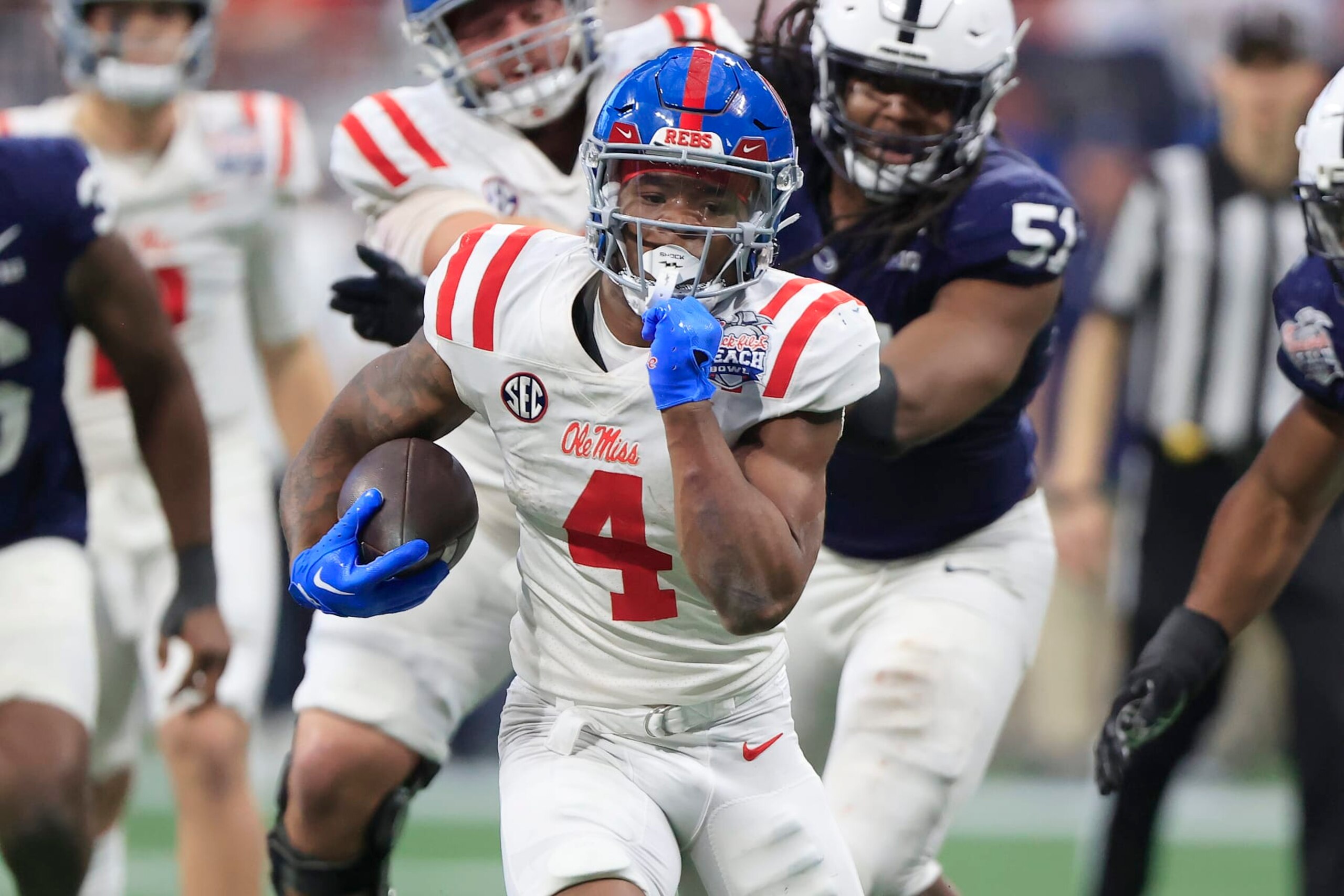 ATLANTA, GA - DECEMBER 30: Mississippi Rebels running back Quinshon Judkins (4) rushes during the Saturday afternoon Chick-fil-A Peach Bowl game between the Penn State Nittany Lions and the Ole Miss Rebels on December 30, 2023 at the Mercedes-Benz Stadium in Atlanta, Georgia.   (Photo by David J. Griffin/Icon Sportswire via Getty Images)