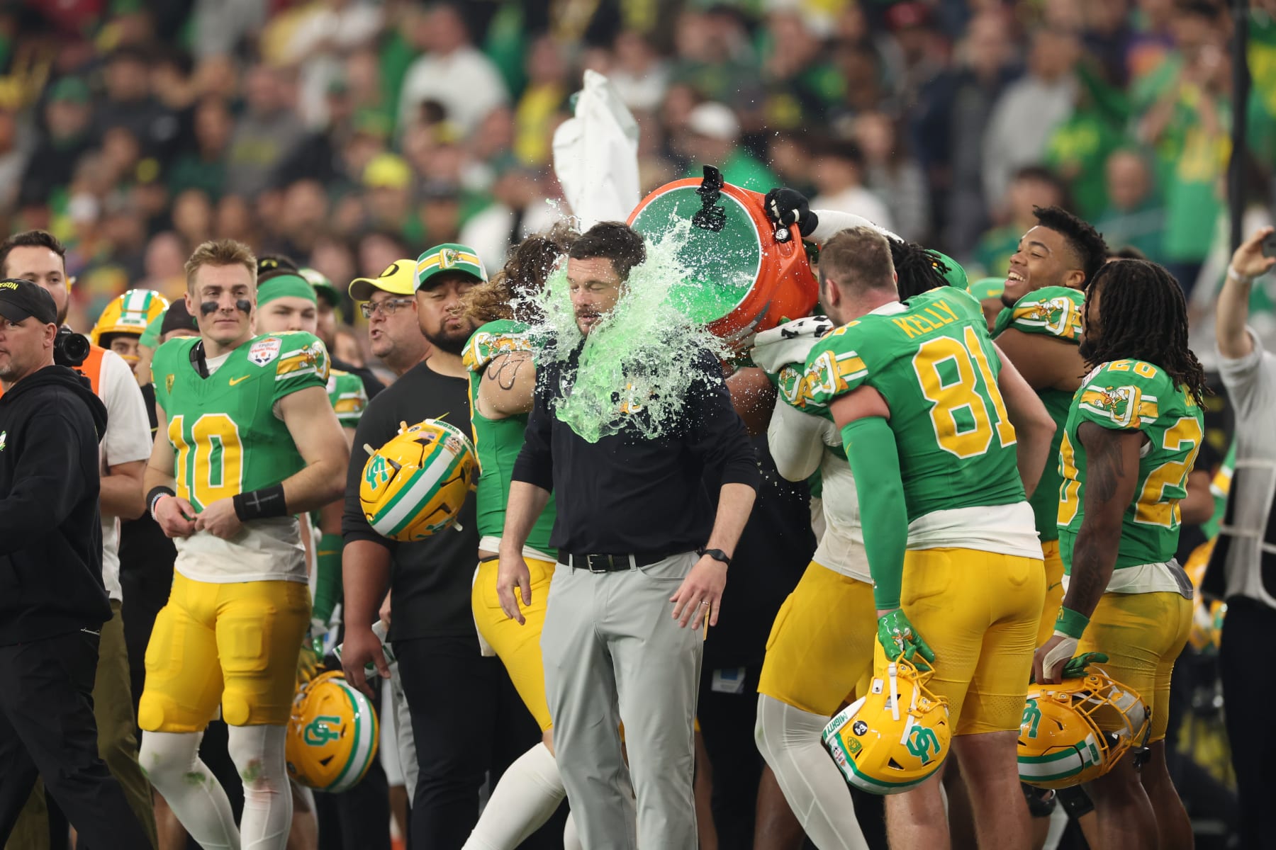 GLENDALE, ARIZONA - JANUARY 01: Head coach Dan Lanning of the Oregon Ducks is dunked with gatorade during the final moments of the Fiesta Bowl against the Liberty Flames at State Farm Stadium on January 01, 2024 in Glendale, Arizona. The Ducks defeated the Flames 45-6. (Photo by Christian Petersen/Getty Images)
