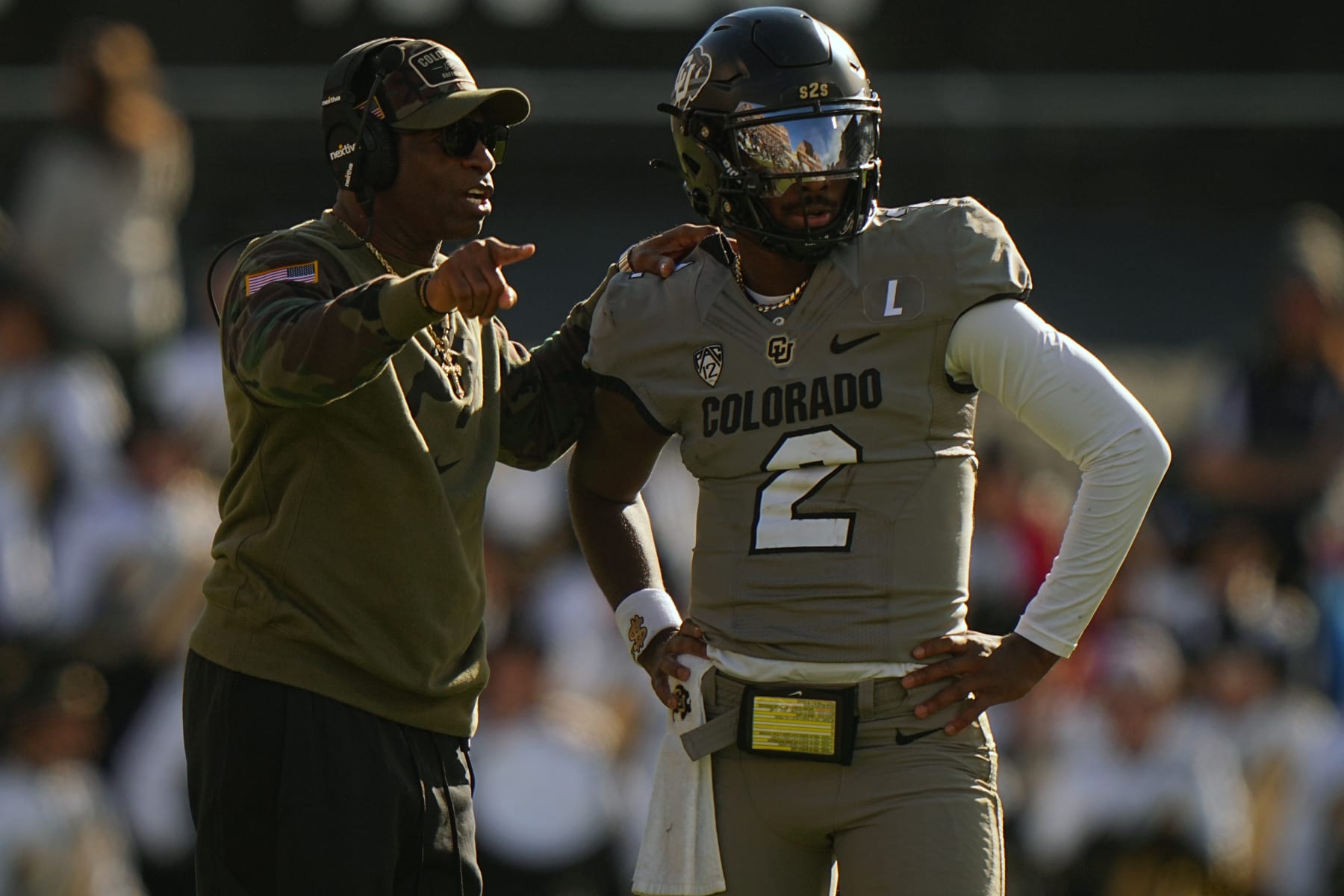 College Football: Colorado head coach Deion Sanders talks with quarterback Shedeur Sanders (2) vs Arizona at Folsom Field. 
Boulder, CO 11/11/2023 
CREDIT: Erick W. Rasco (Photo by Erick W. Rasco/Sports Illustrated via Getty Images) 
(Set Number: X164462)