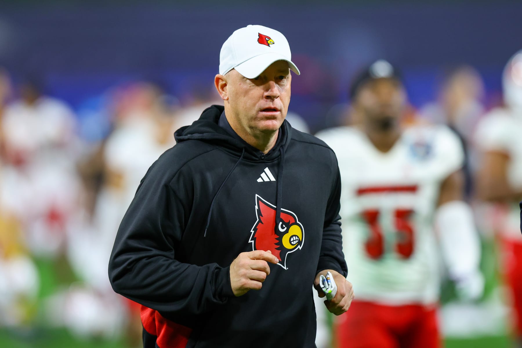 SAN DIEGO, CA - DECEMBER 27: Louisville Cardinals head coach Jeff Brohm runs off of the field during the Directv Holiday Bowl football game between the Louisville Cardinals and the USC Trojans on December 27, 2023, at Petco Park in San Diego, CA. (Photo by Jordon Kelly/Icon Sportswire via Getty Images)