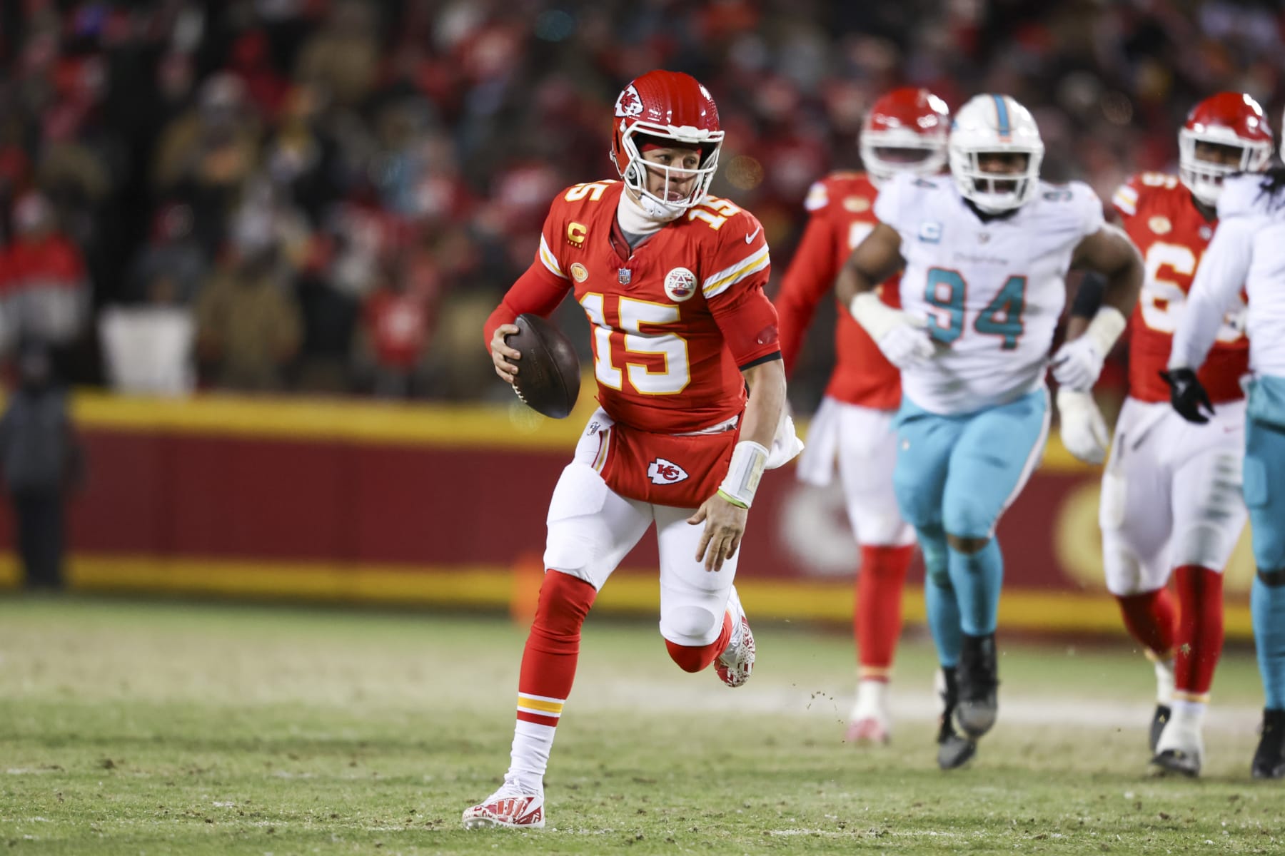KANSAS CITY, MISSOURI - JANUARY 13: Patrick Mahomes #15 of the Kansas City Chiefs runs the ball during an NFL Super Wild Card Weekend playoff game against the Miami Dolphins at GEHA Field at Arrowhead Stadium on January 13, 2024 in Kansas City, Missouri. (Photo by Kara Durrette/Getty Images)