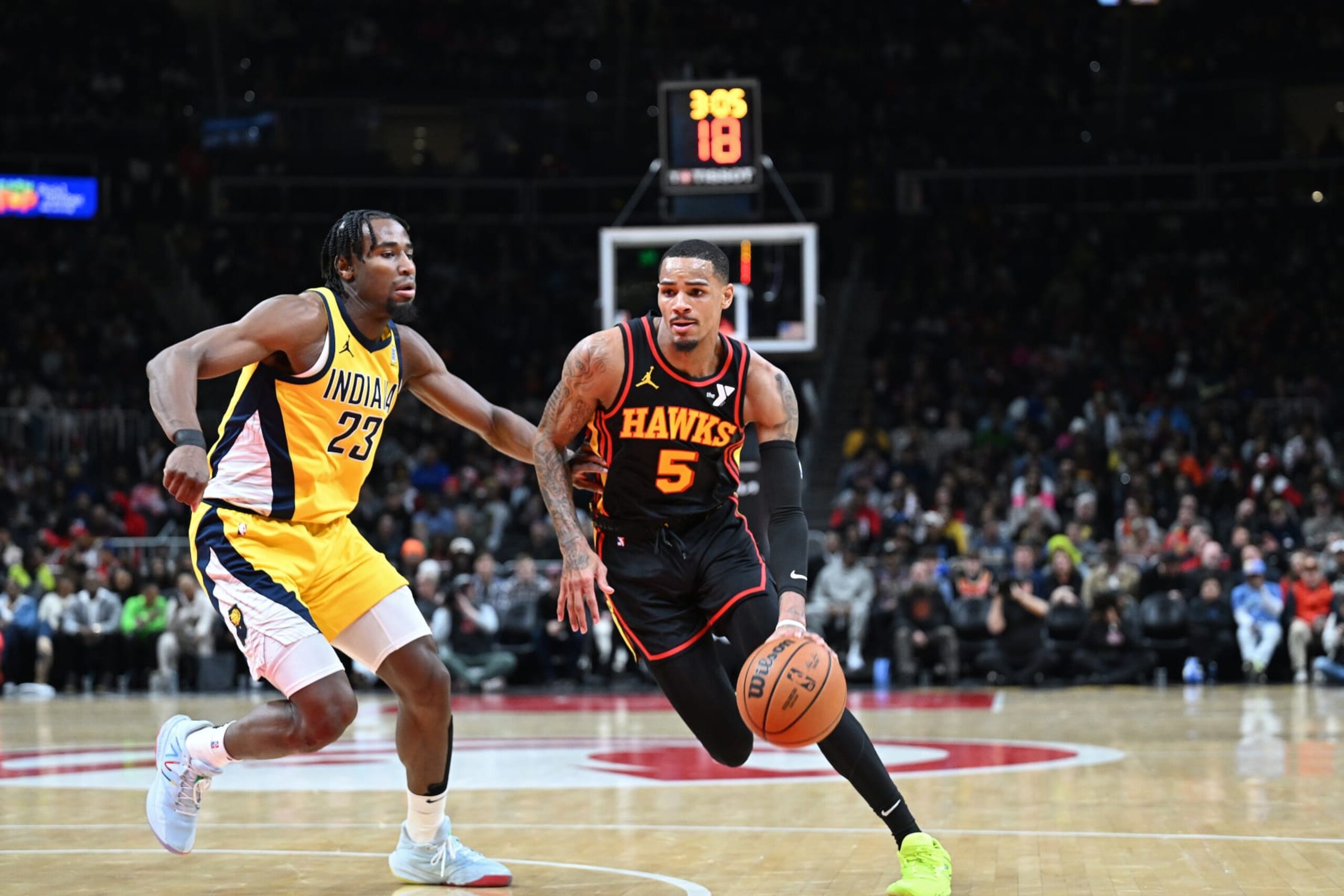 ATLANTA, GA - JANUARY 12: Dejounte Murray #5 of the Atlanta Hawks dribbles the ball during the game against the Indiana Pacers on January 12, 2024 at State Farm Arena in Atlanta, Georgia.  NOTE TO USER: User expressly acknowledges and agrees that, by downloading and/or using this Photograph, user is consenting to the terms and conditions of the Getty Images License Agreement. Mandatory Copyright Notice: Copyright 2024 NBAE (Photo by Adam Hagy/NBAE via Getty Images)
